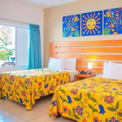 Photo of the whole room, Bed in Decameron Los Cocos Guayabitos, Ramada All-Inclusive Resort
