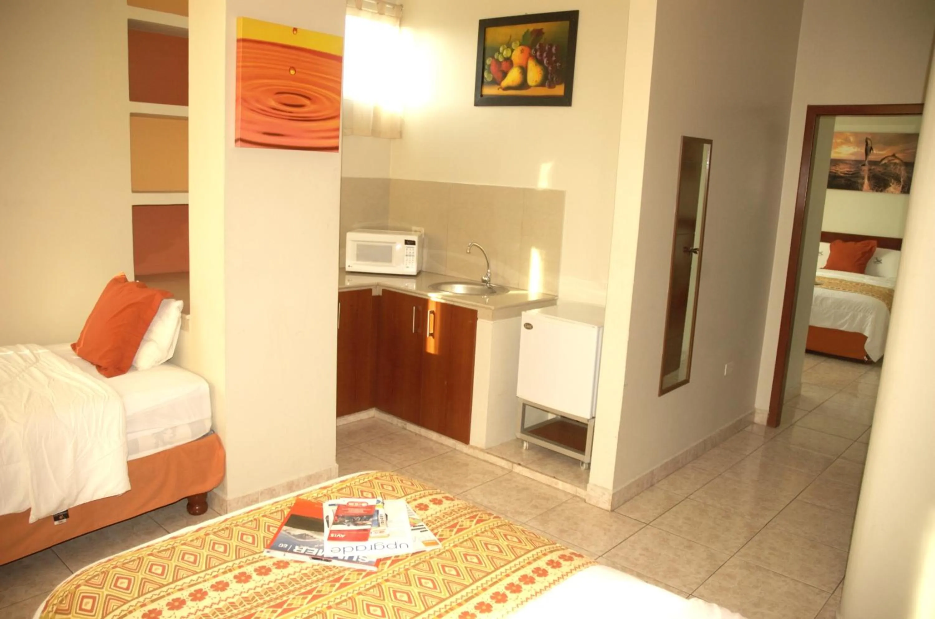 Kitchen or kitchenette, Bed in Hotel Air Suites