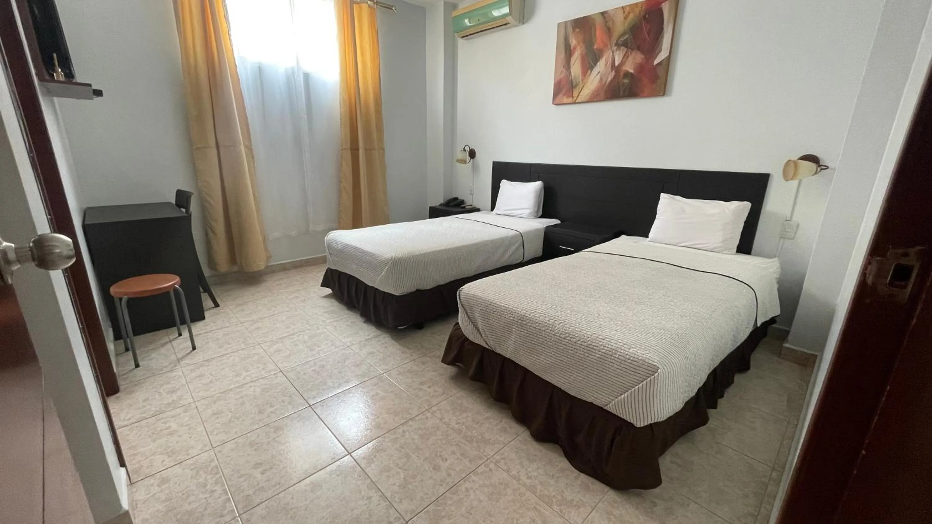 Bed in Hotel Air Suites