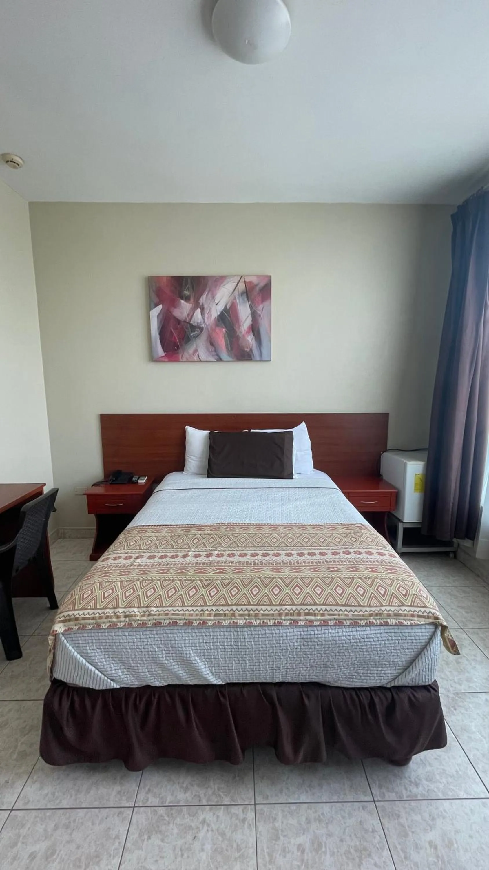 Bed in Hotel Air Suites