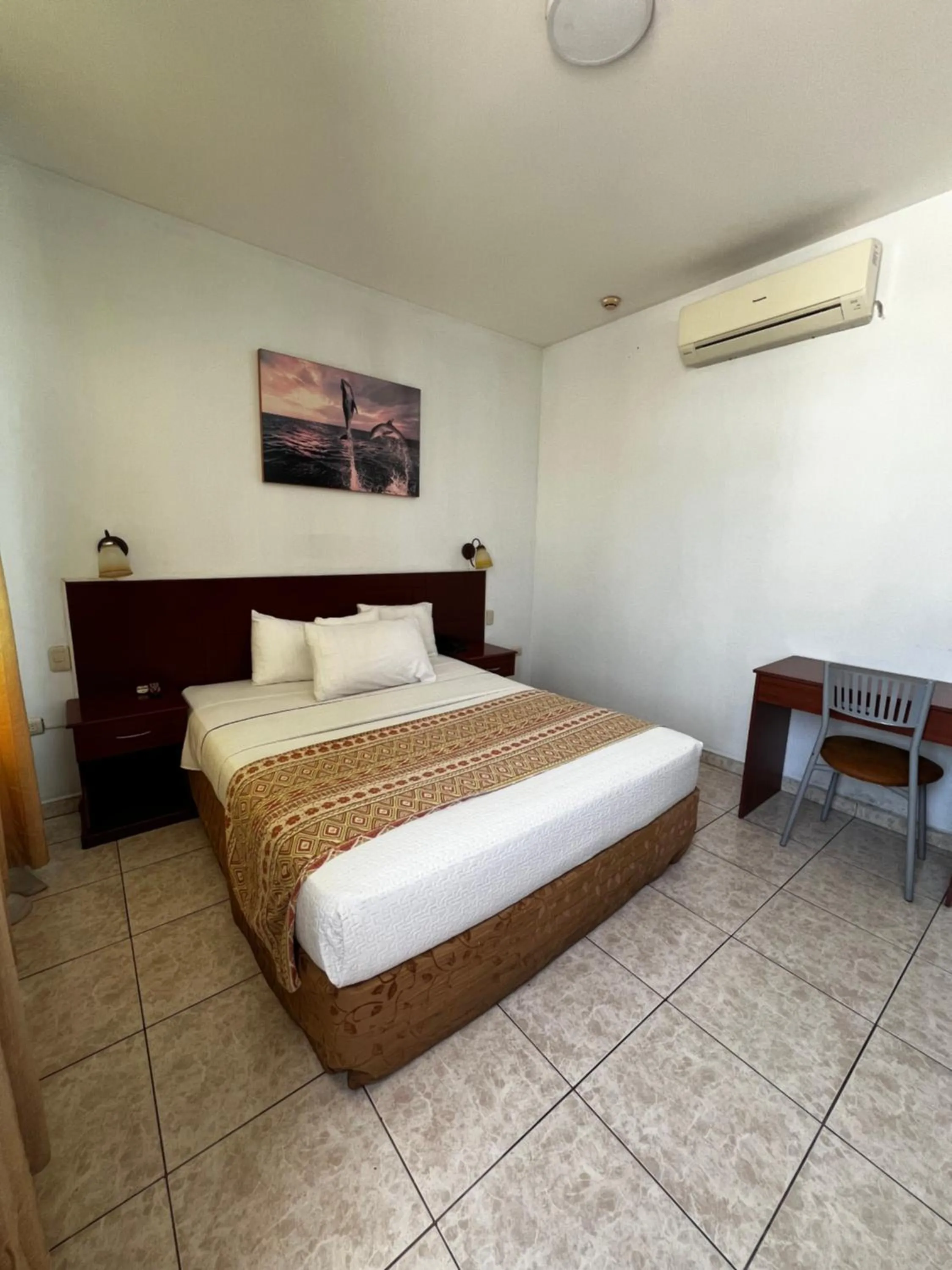 Bed in Hotel Air Suites