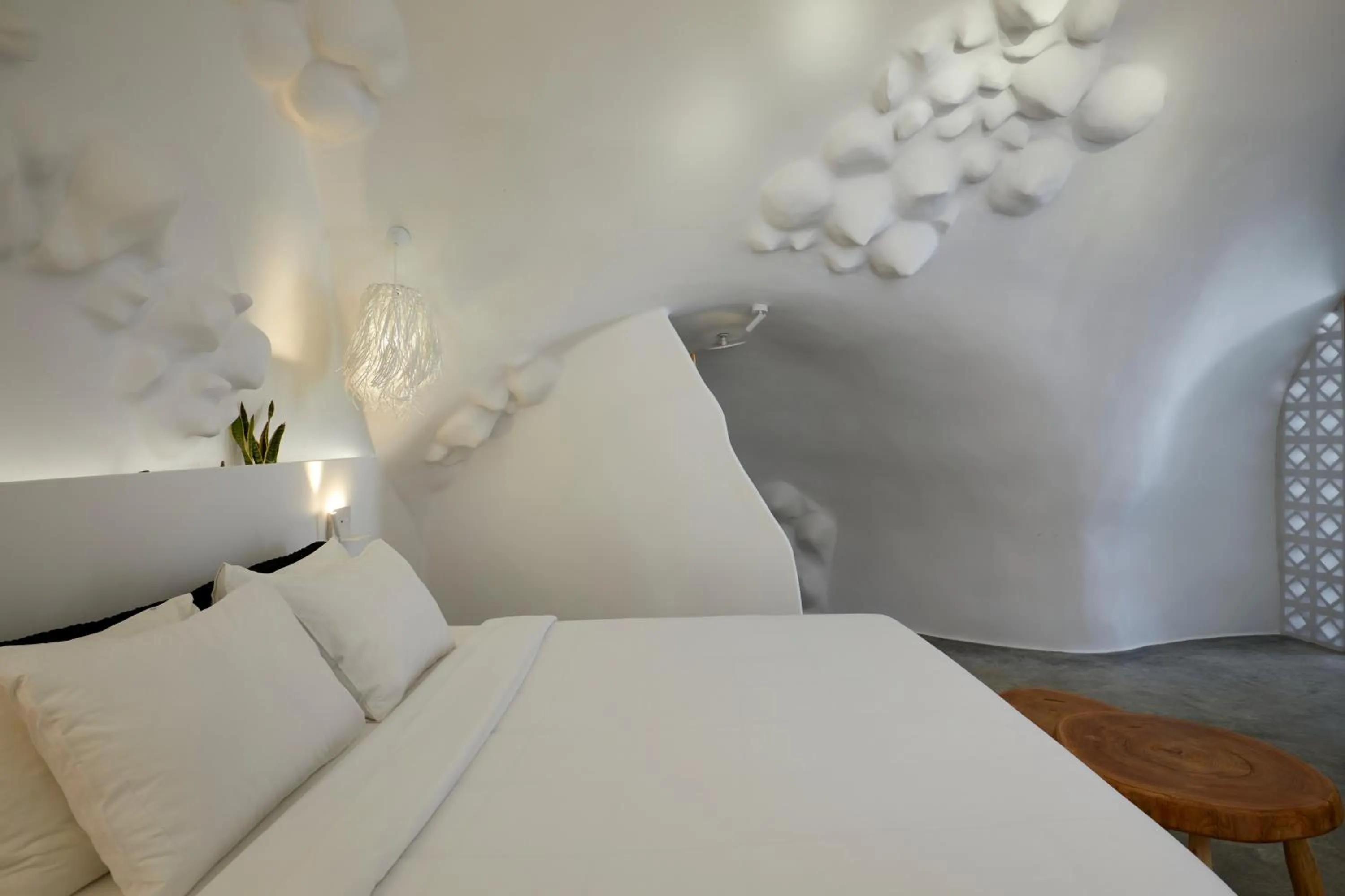 Bed in Theano Cave Suites & Villas