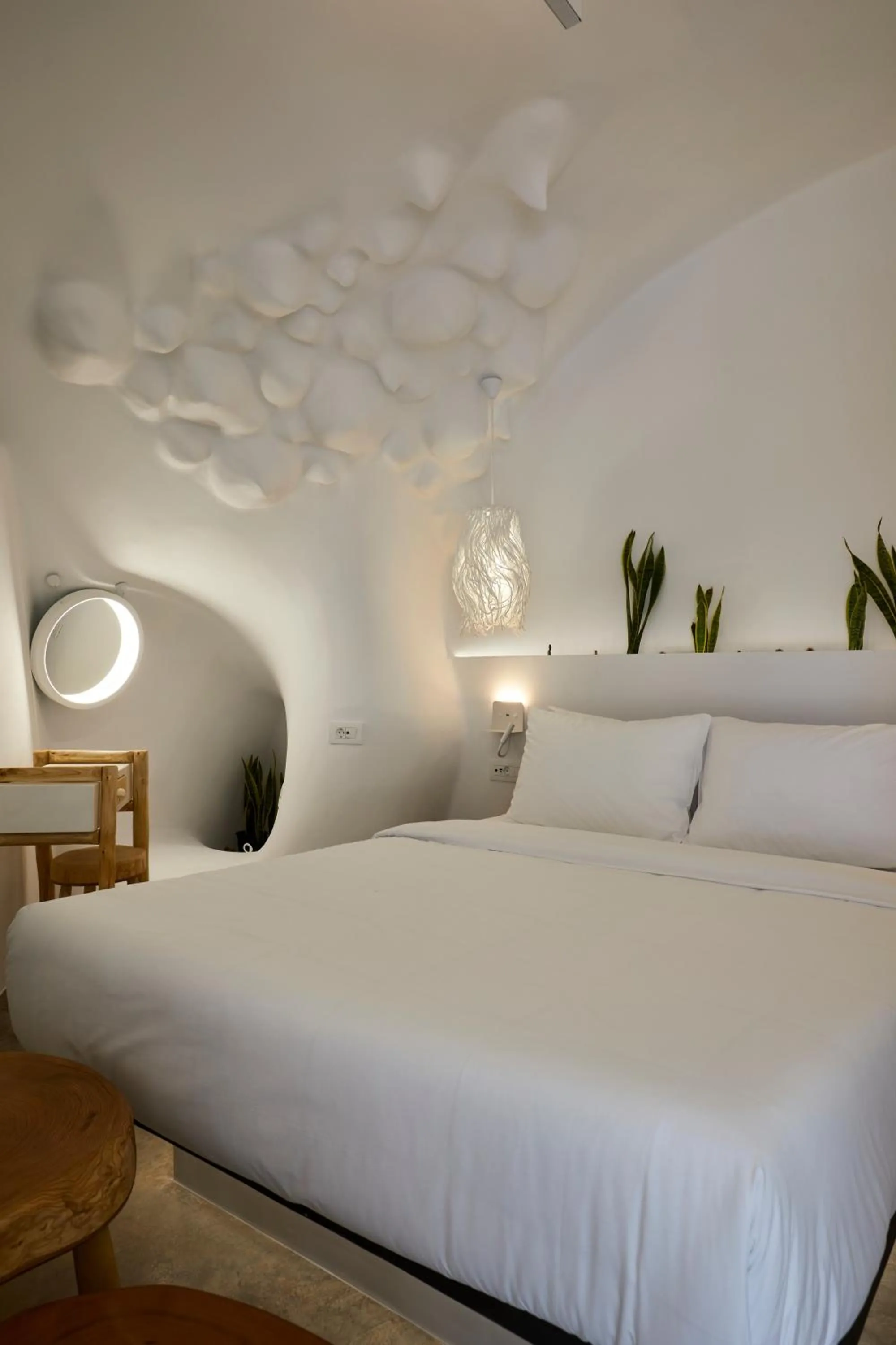 Bed in Theano Cave Suites & Villas