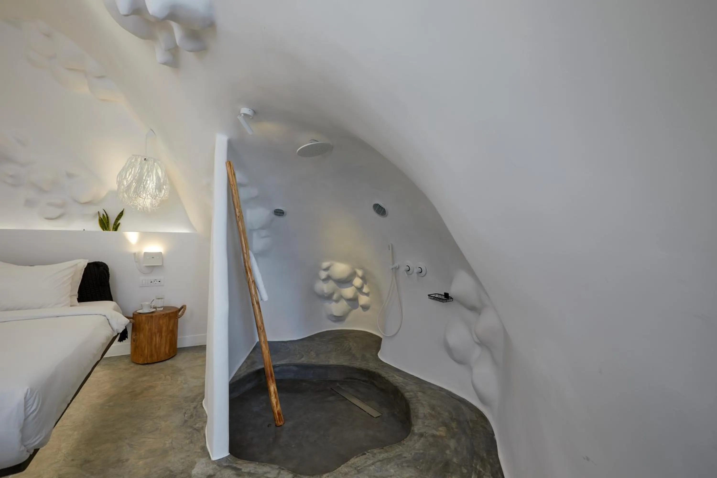 Bed in Theano Cave Suites & Villas