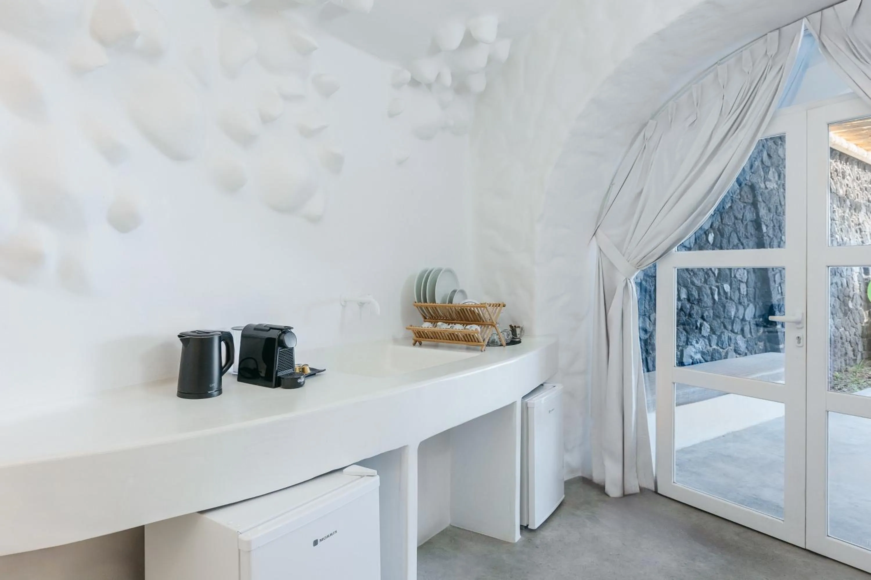 Bed in Theano Cave Suites & Villas