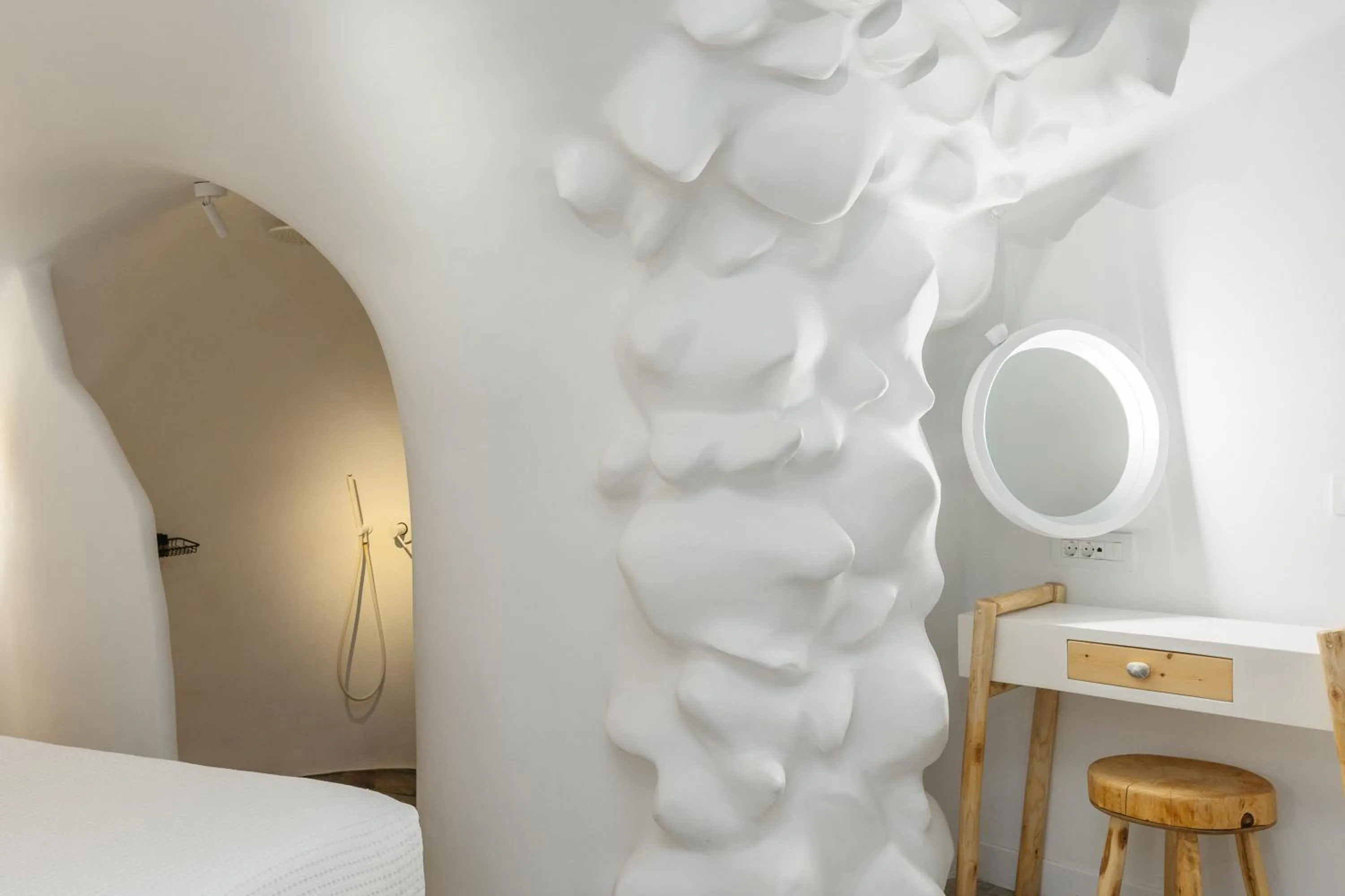 Bed in Theano Cave Suites & Villas