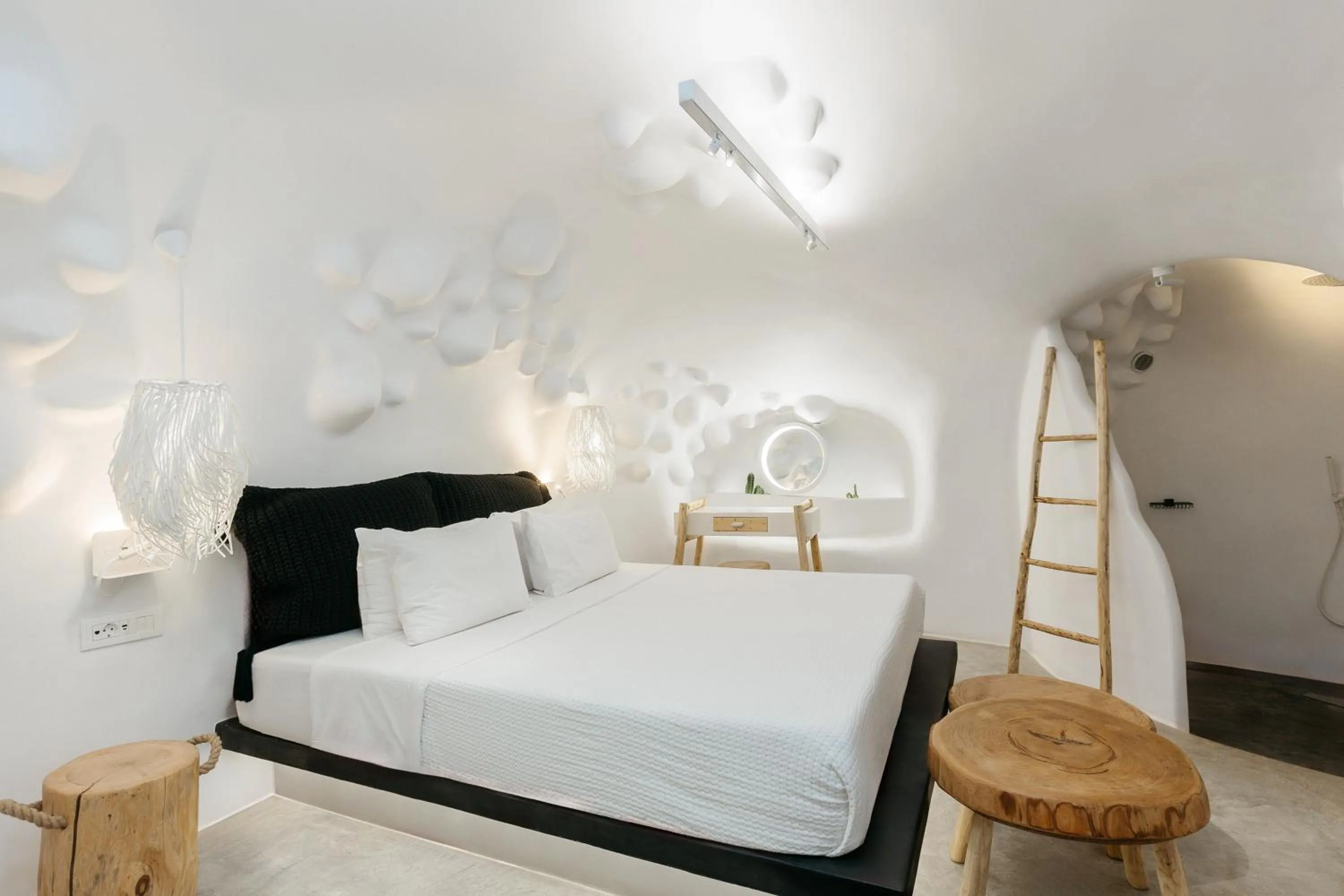 Bed in Theano Cave Suites & Villas