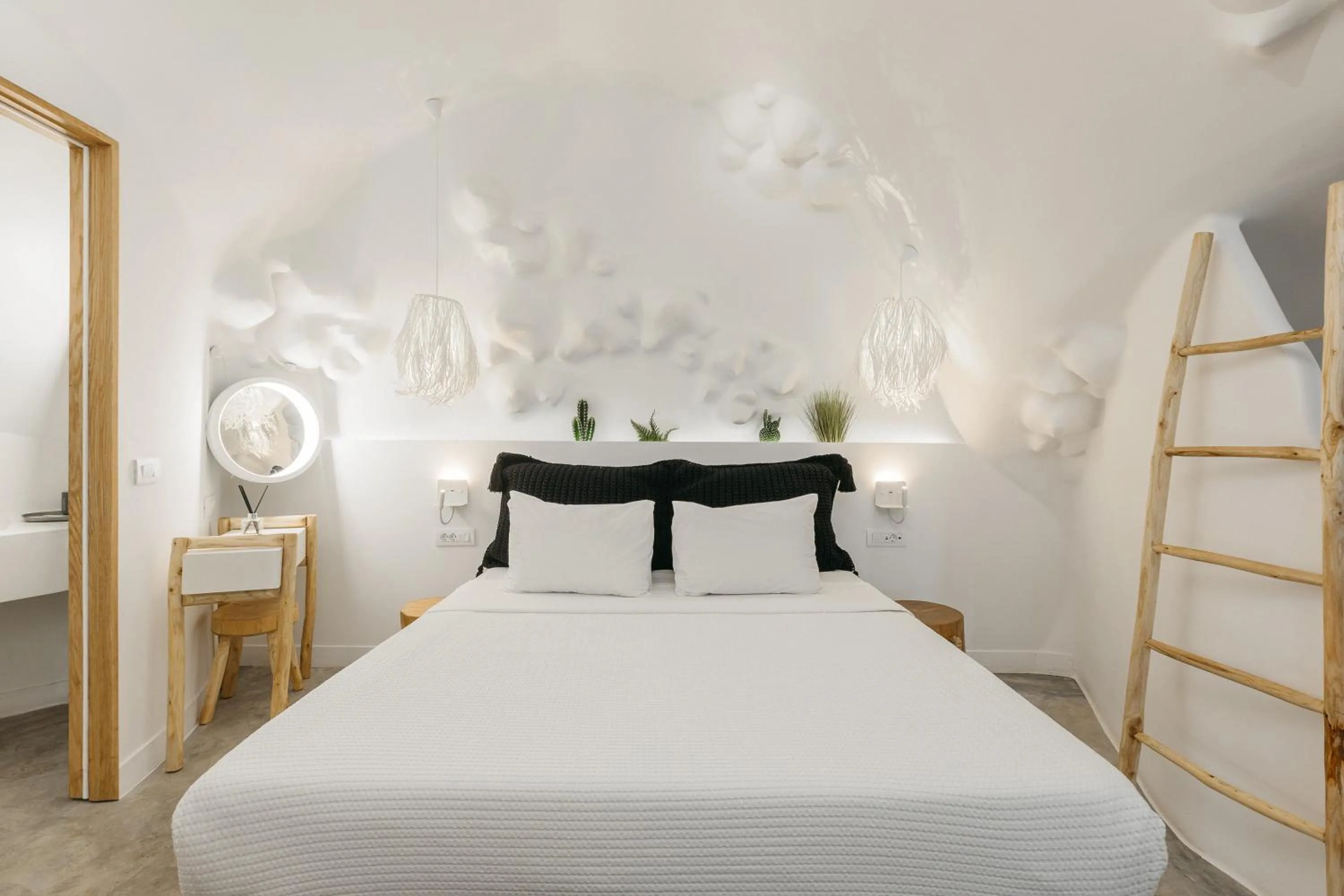 Bed in Theano Cave Suites & Villas