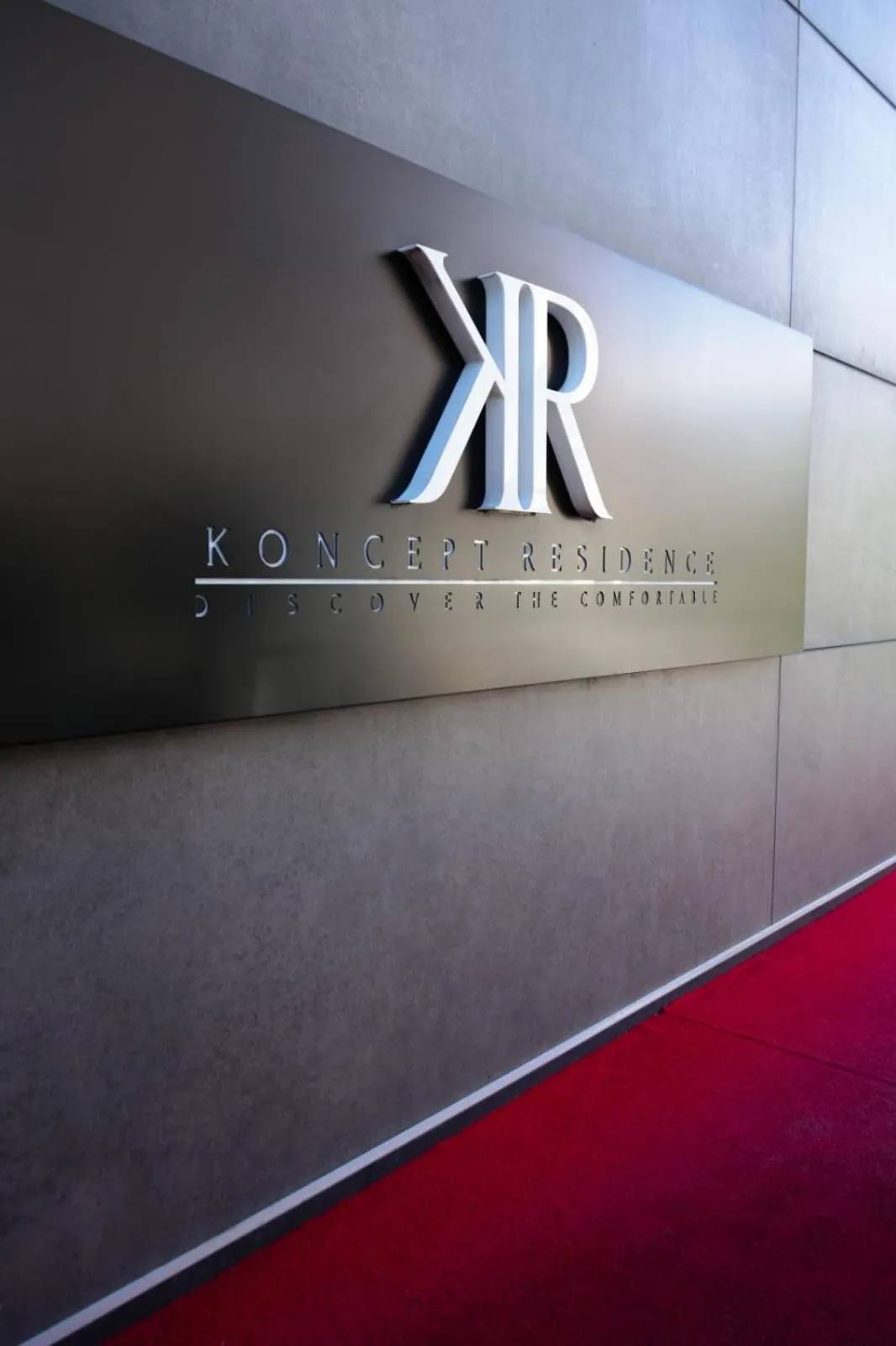 Property logo or sign in Hotel Koncept Residence