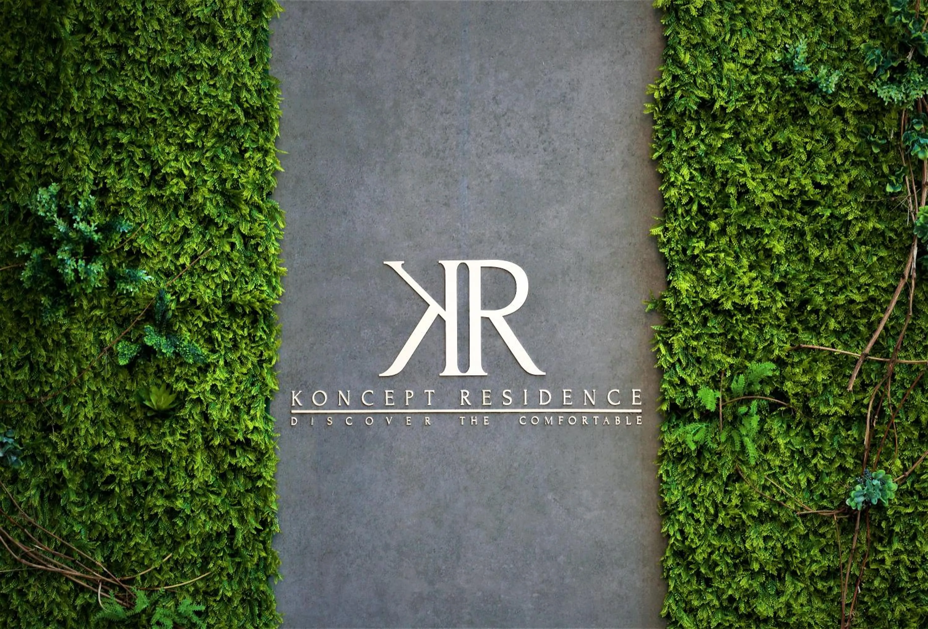 Property logo or sign in Hotel Koncept Residence