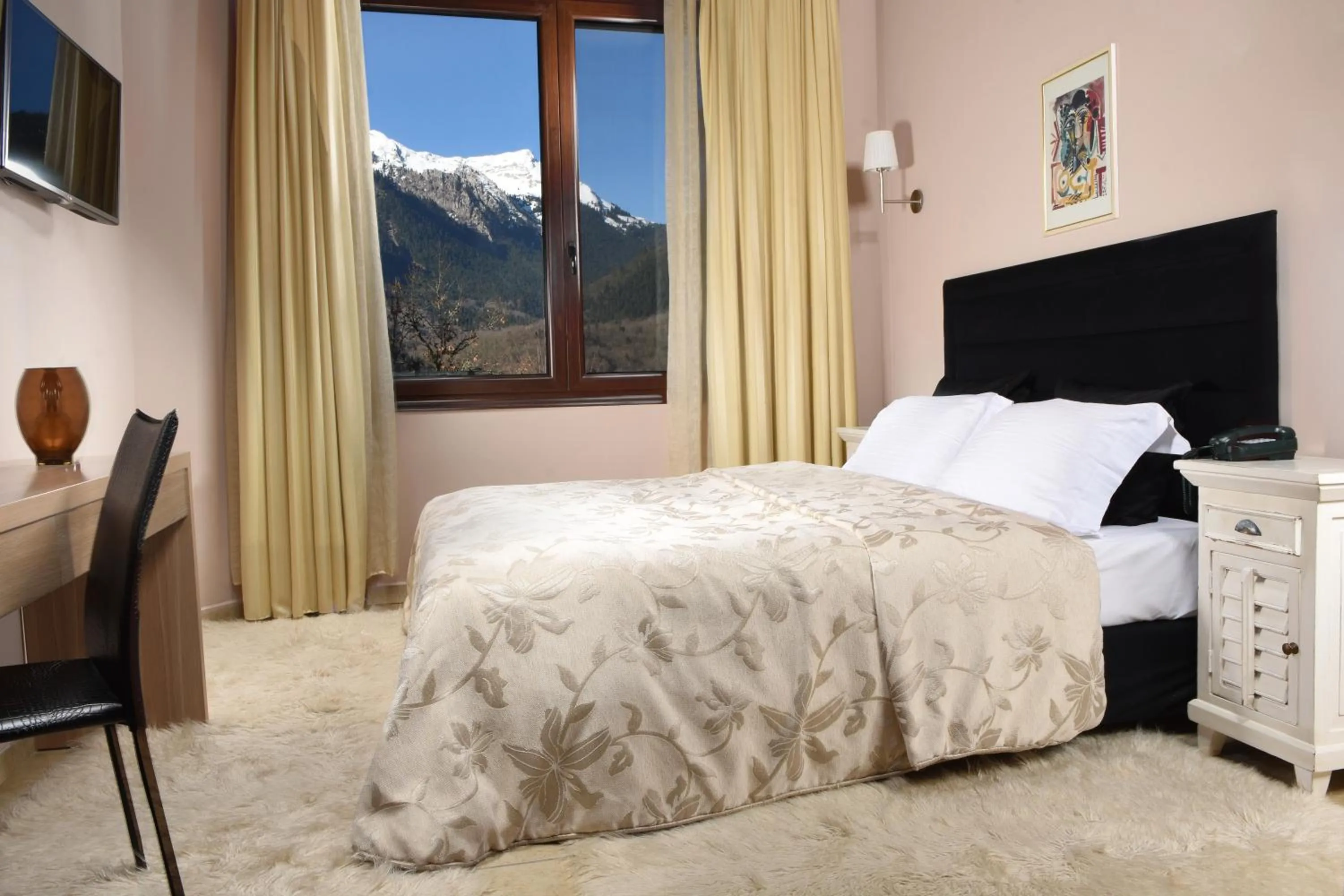 Bed in Forest Suites Boutique Hotel