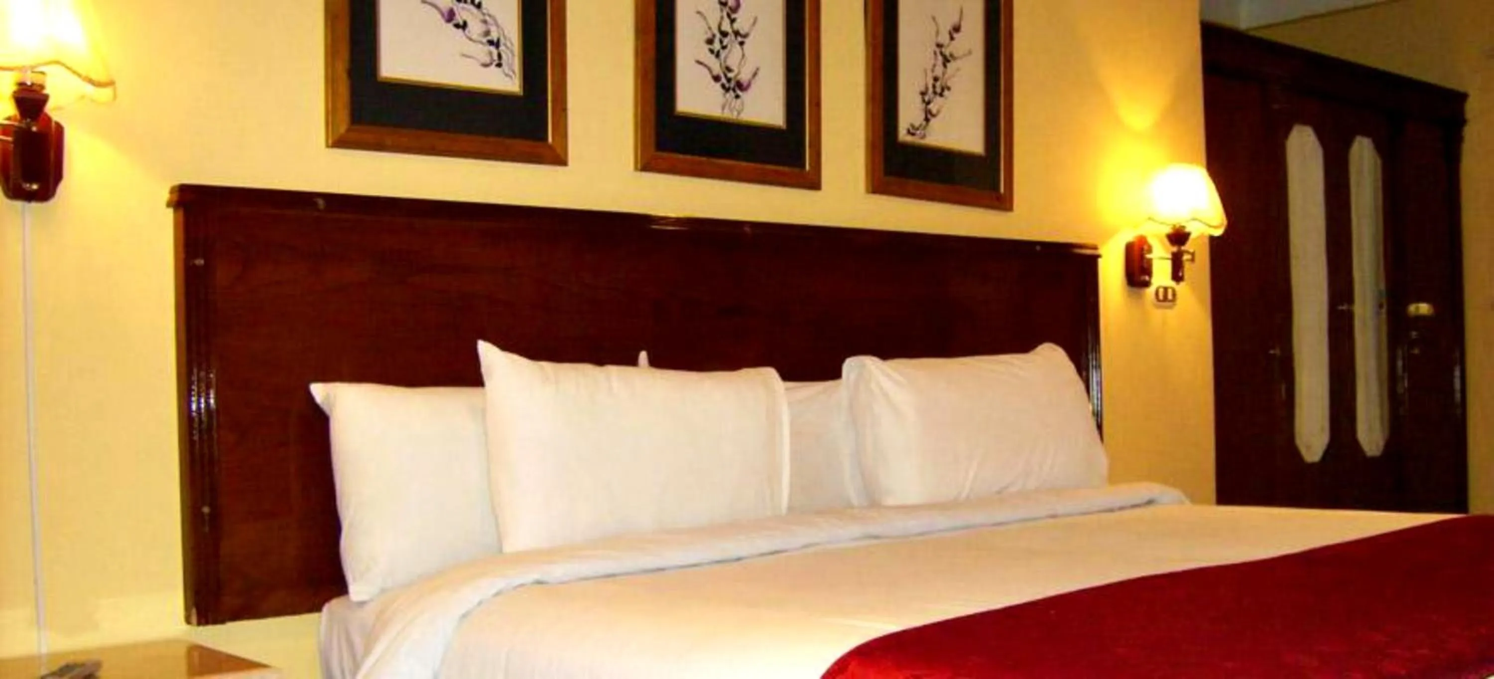 Bed in Alexandria Mediterranean Suites