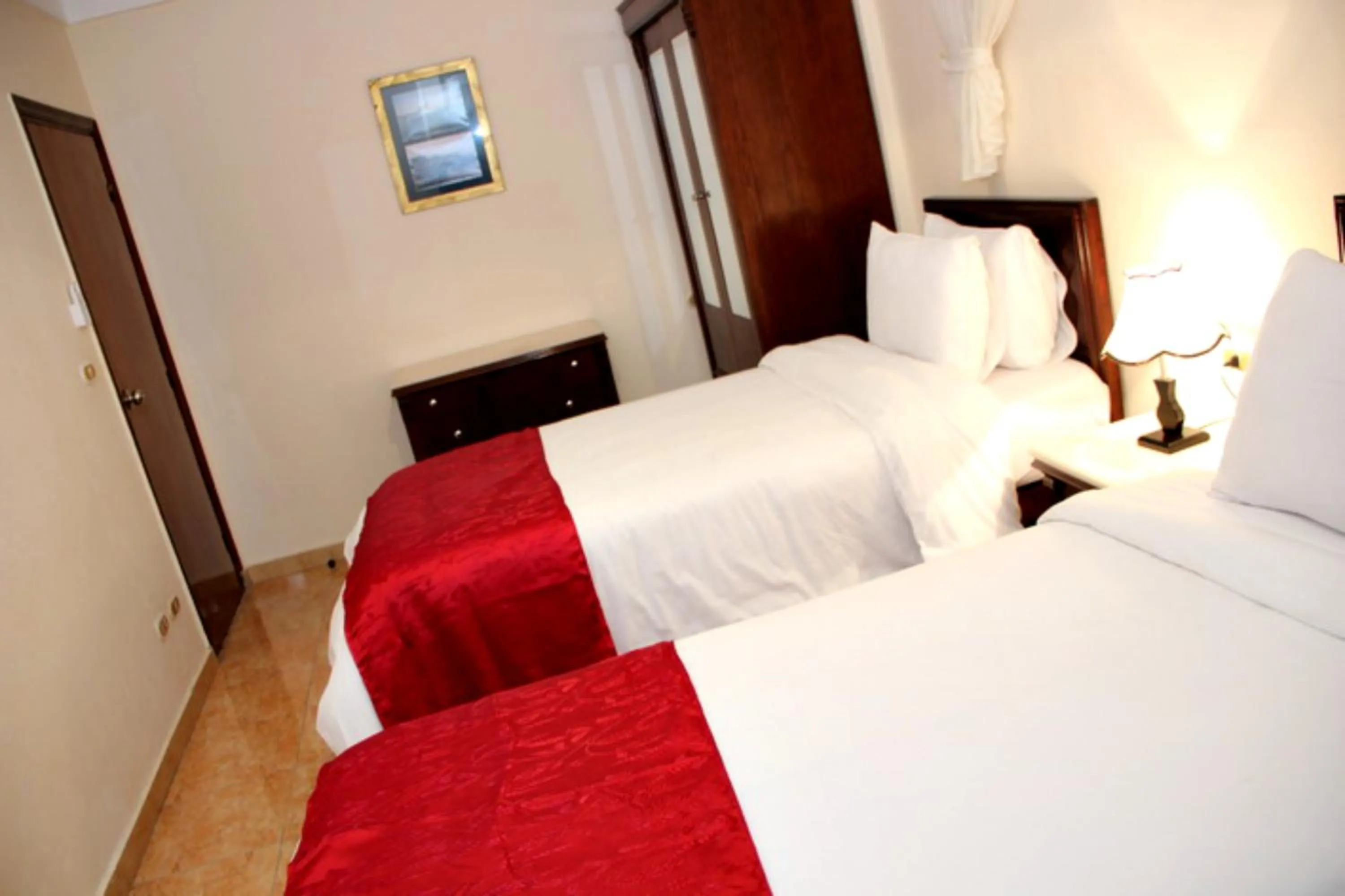 Bed in Alexandria Mediterranean Suites