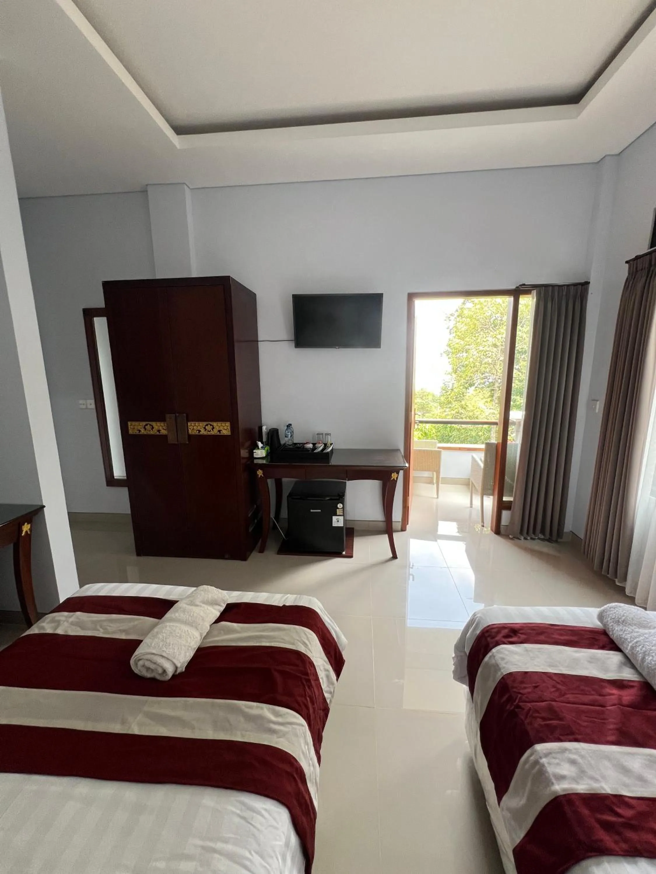 Bed in Mandhasativa Homestay