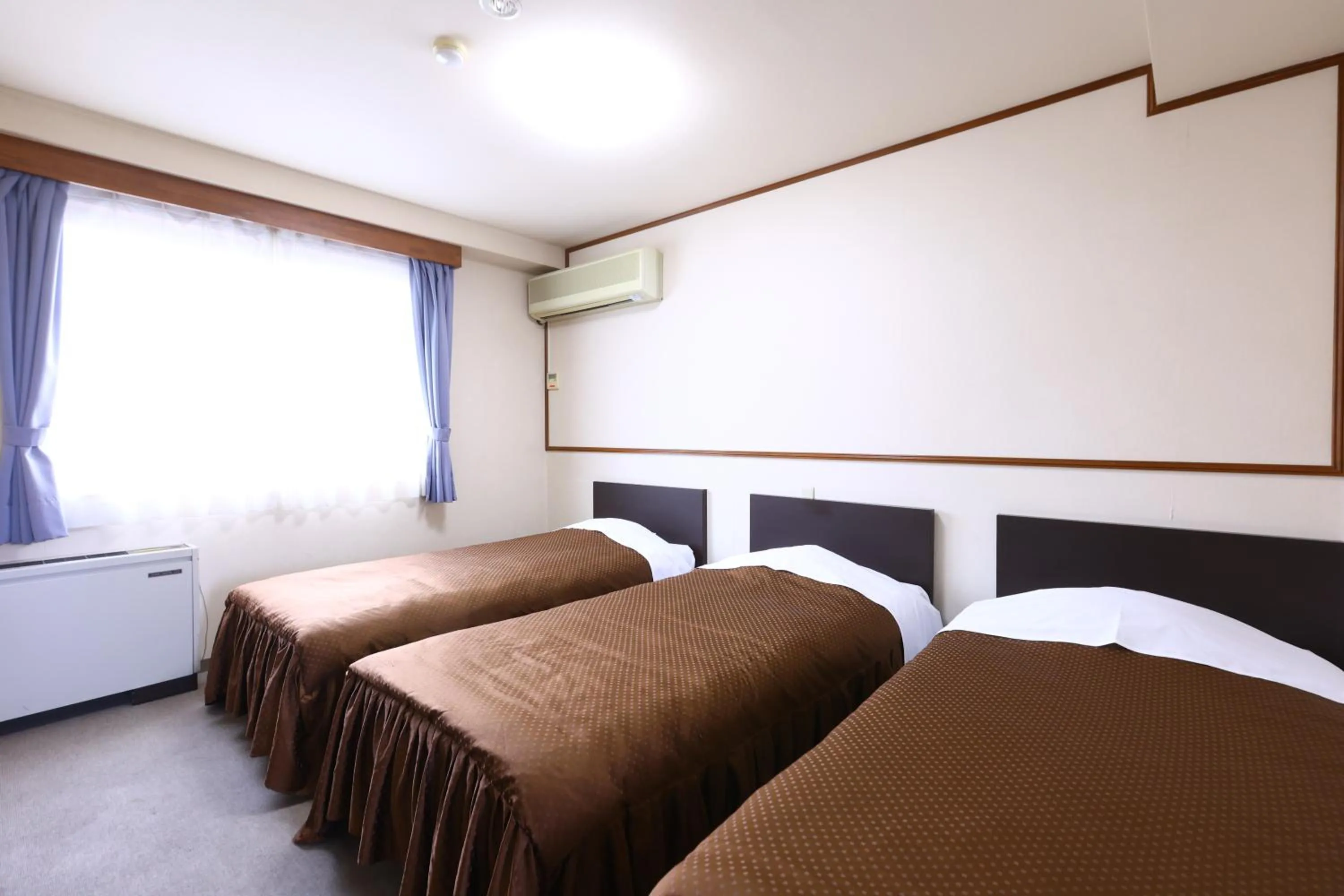 Bed in Hotel Sunplaza Tsugaike