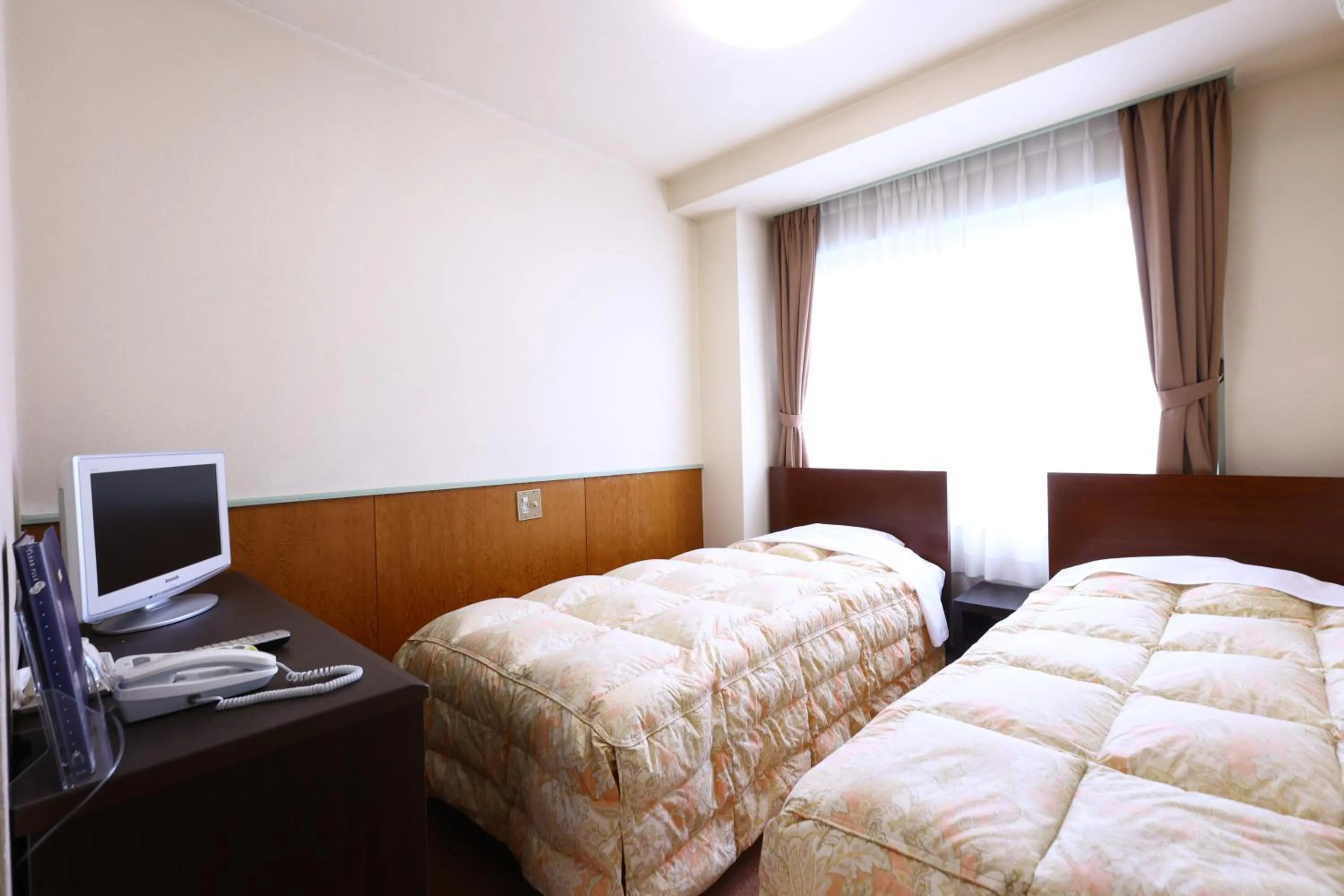 Bed in Hotel Sunplaza Tsugaike