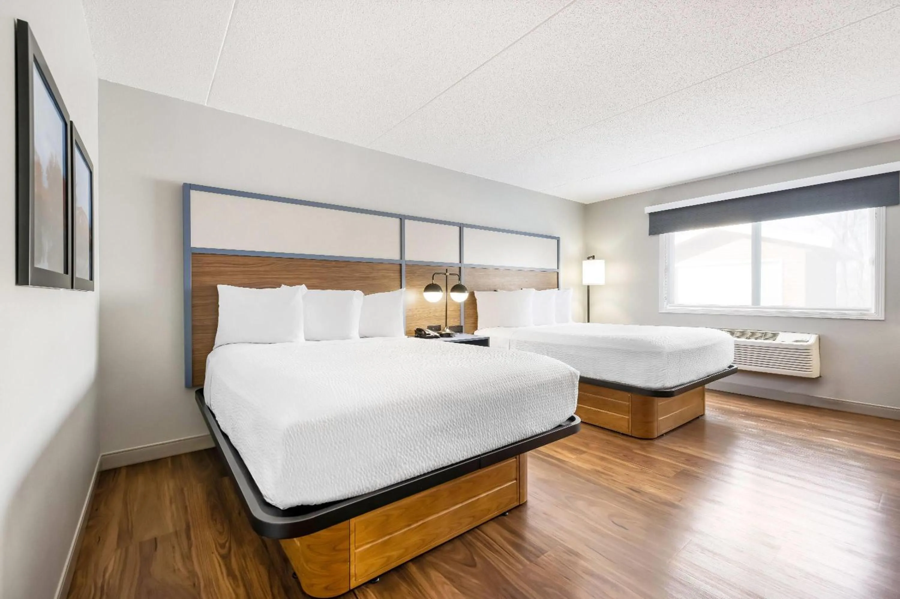 Bed in AmericInn by Wyndham Valley City Conference Center