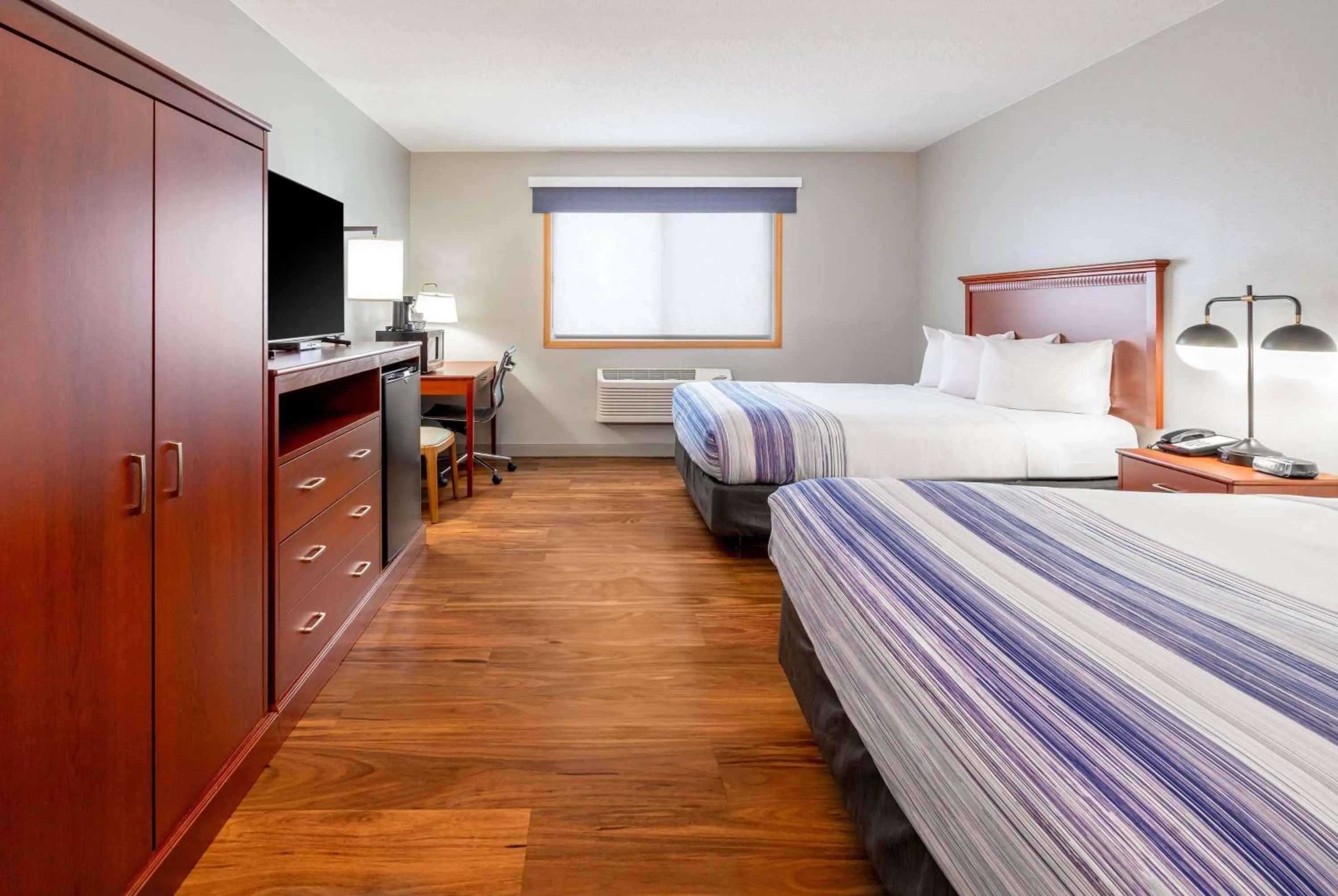Queen Room with Two Queen Beds - Pet Friendly/Non-Smoking in AmericInn by Wyndham Valley City Conference Center
