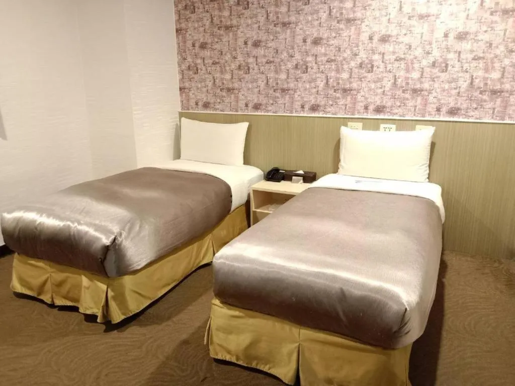 Bed in 西門大飯店 Ximen Hotel