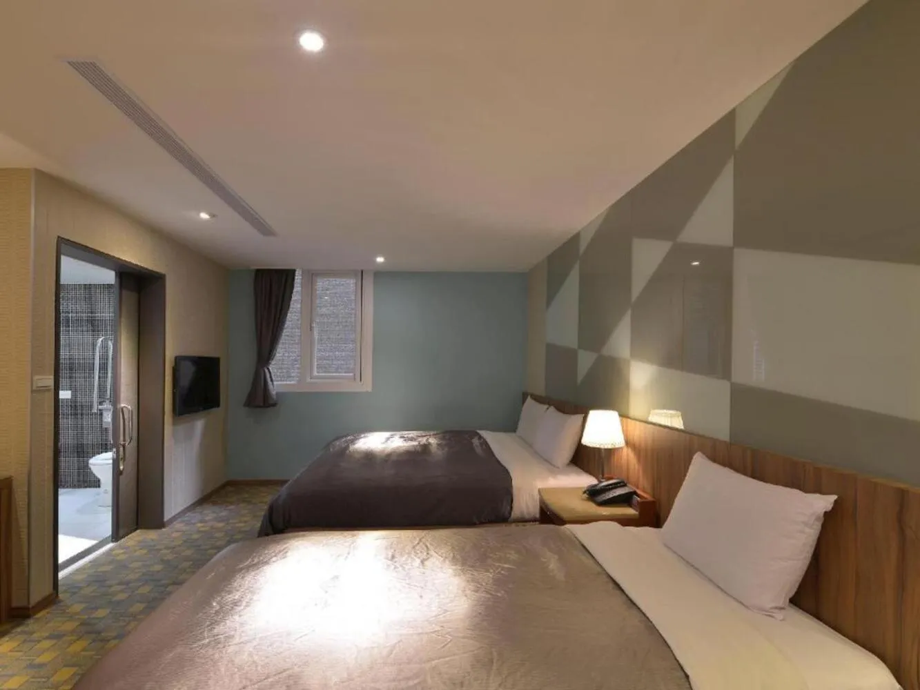 Bed in 西門大飯店 Ximen Hotel