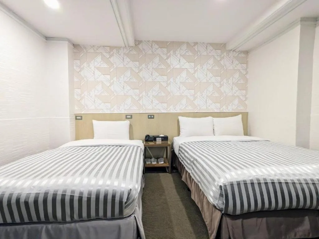 Bed in 西門大飯店 Ximen Hotel