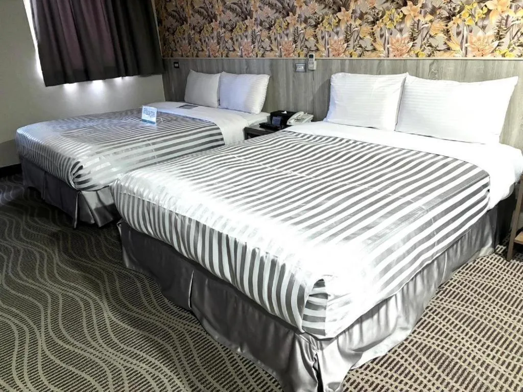 Bed in 西門大飯店 Ximen Hotel