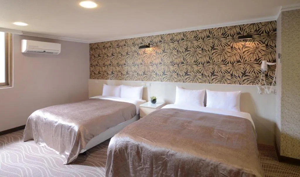 Bed in 西門大飯店 Ximen Hotel