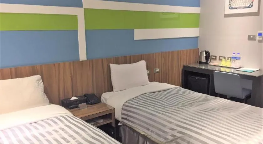 Bed in 西門大飯店 Ximen Hotel