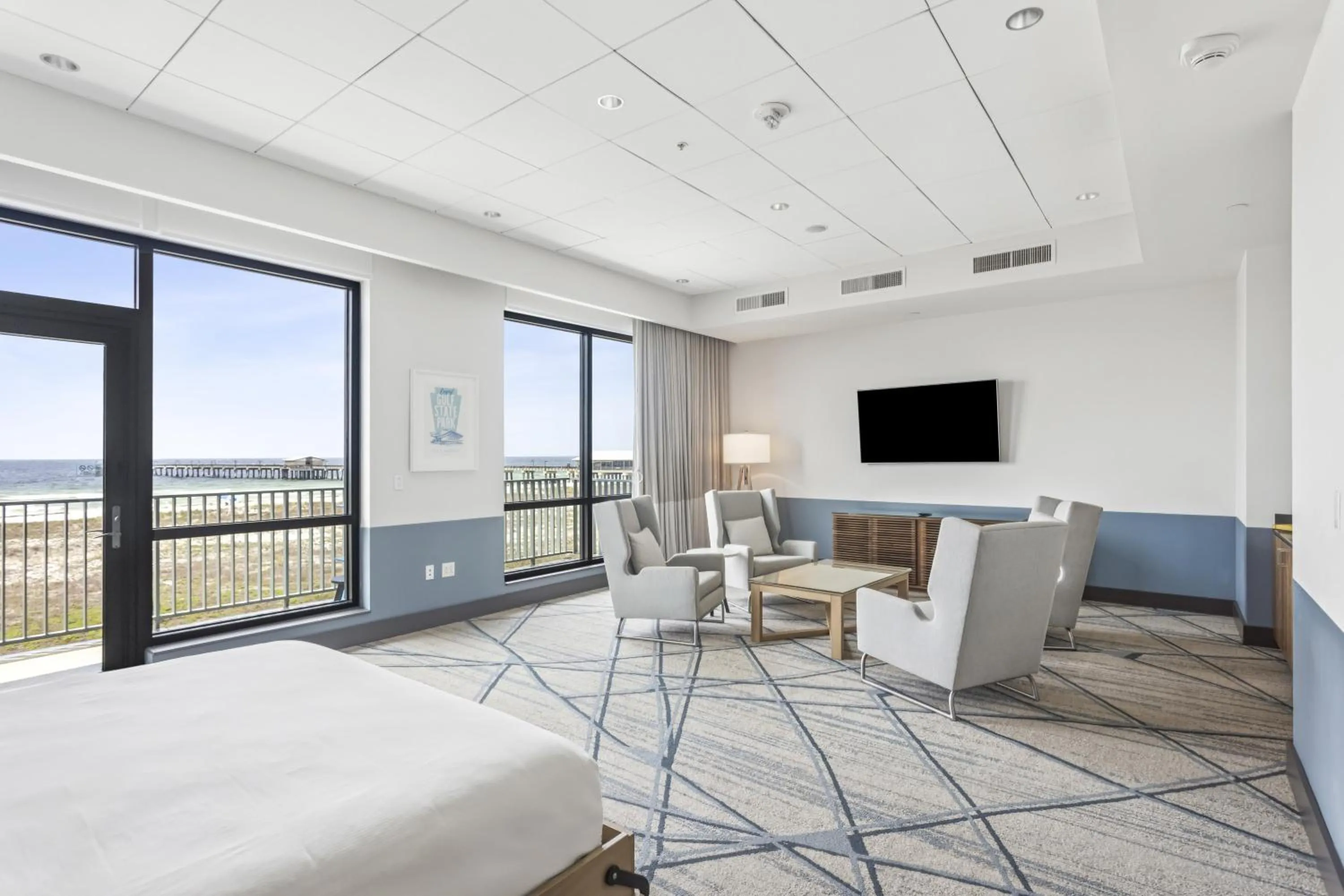Living room, Bed in The Lodge at Gulf State Park, A Hilton Hotel