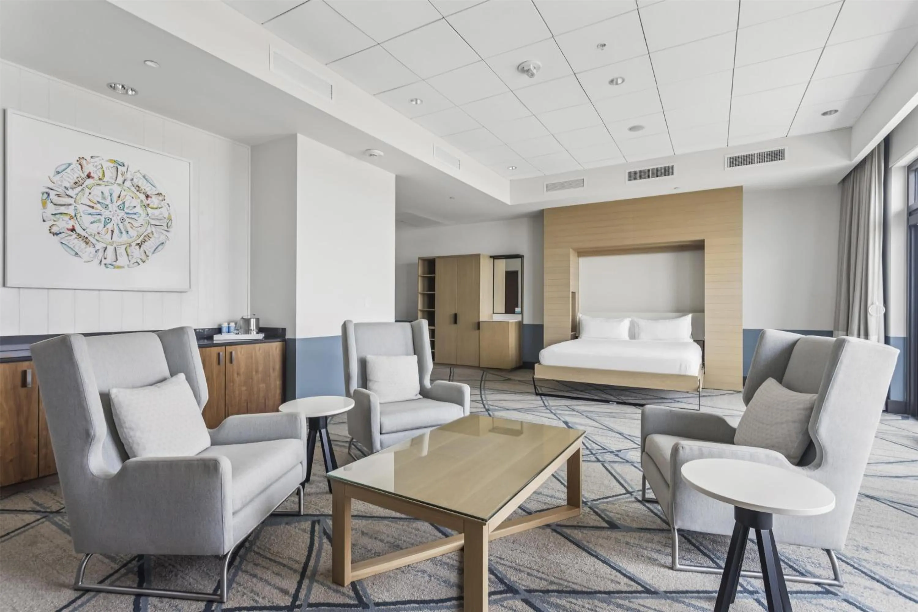 Living room, Bed in The Lodge at Gulf State Park, A Hilton Hotel