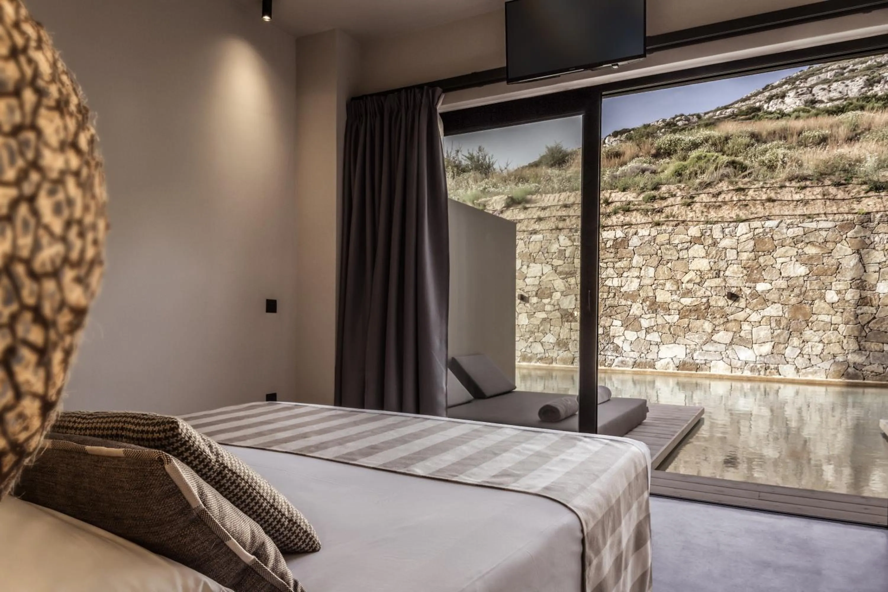 Bed in Doryssa Boutique Hotel