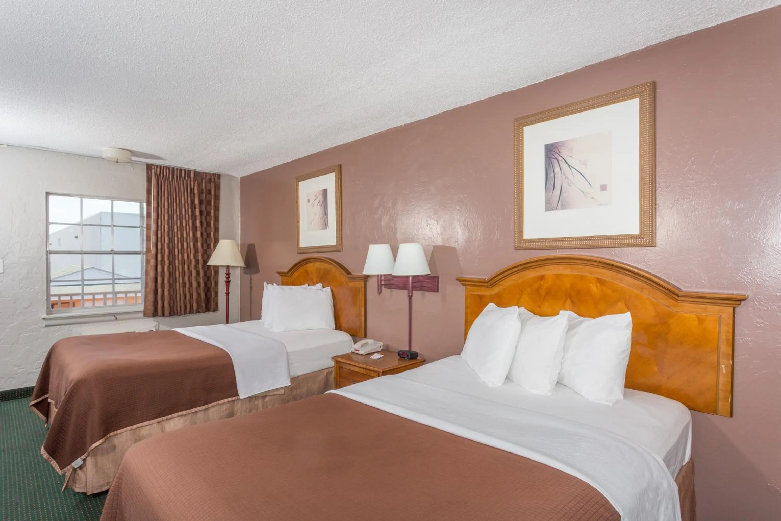 Bed in Howard Johnson by Wyndham Ft. Myers FL