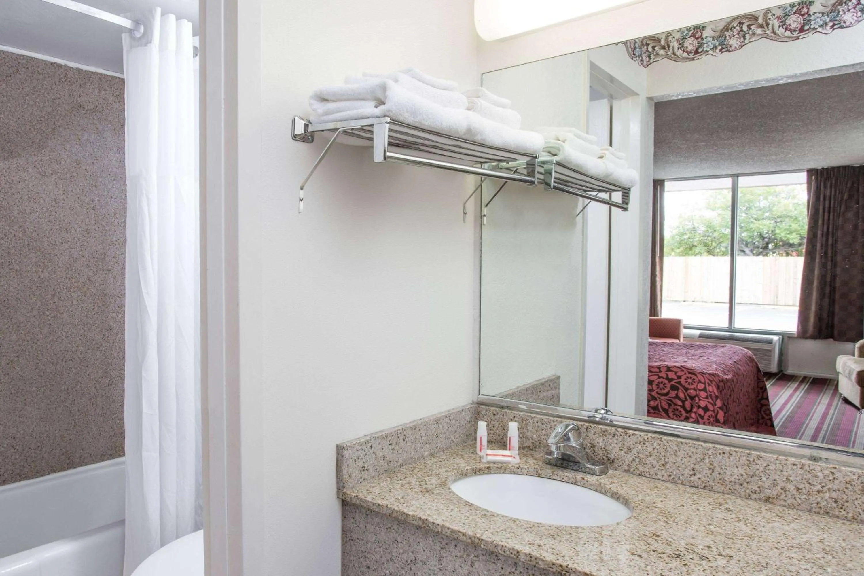 Bathroom, Bed in Days Inn by Wyndham Fort Myers