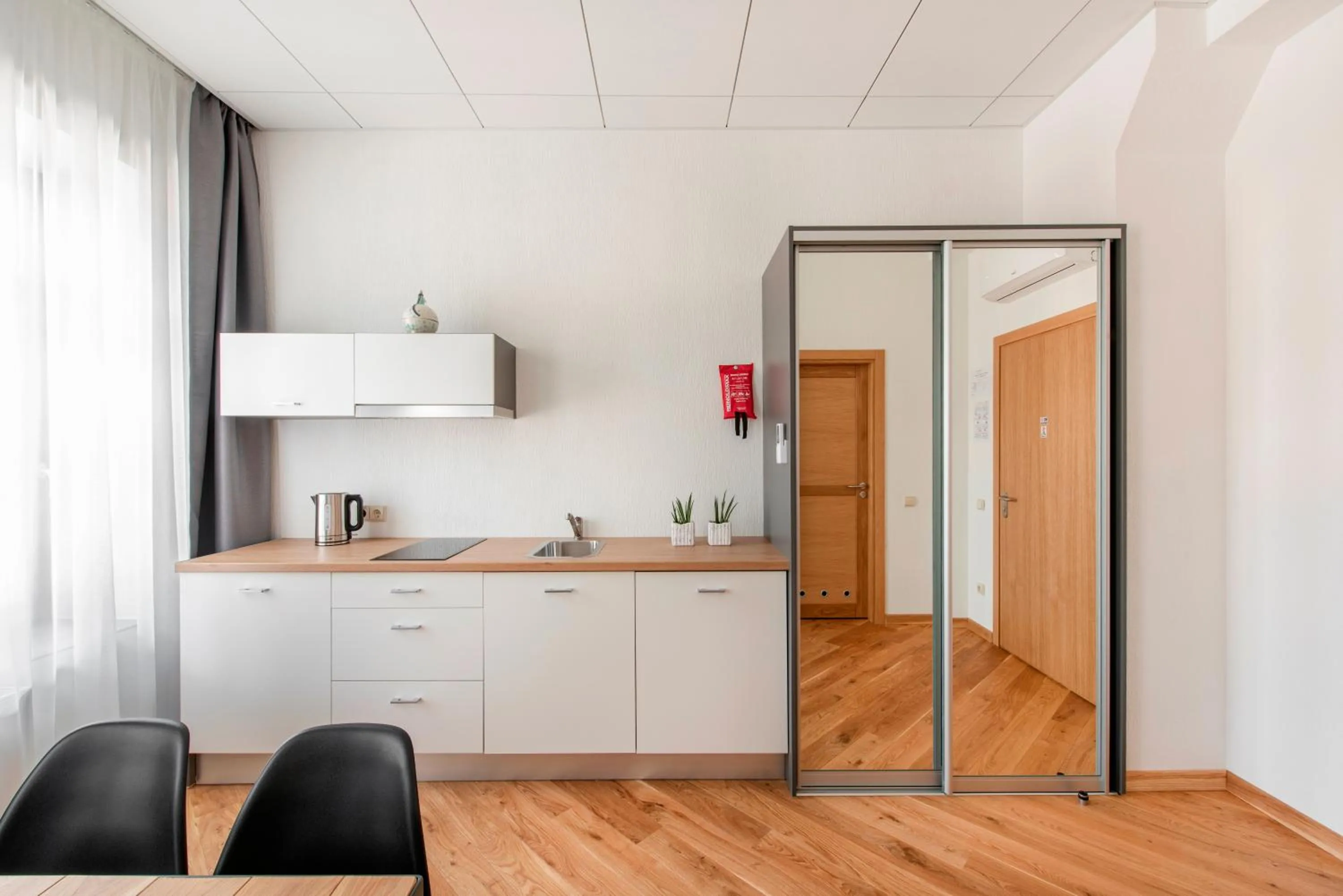 Kitchen or kitchenette in Piano Apartments