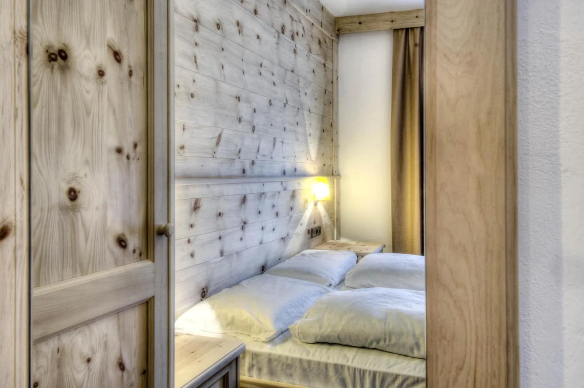 Bed in Family and Wellness Residence Ciasa Antersies