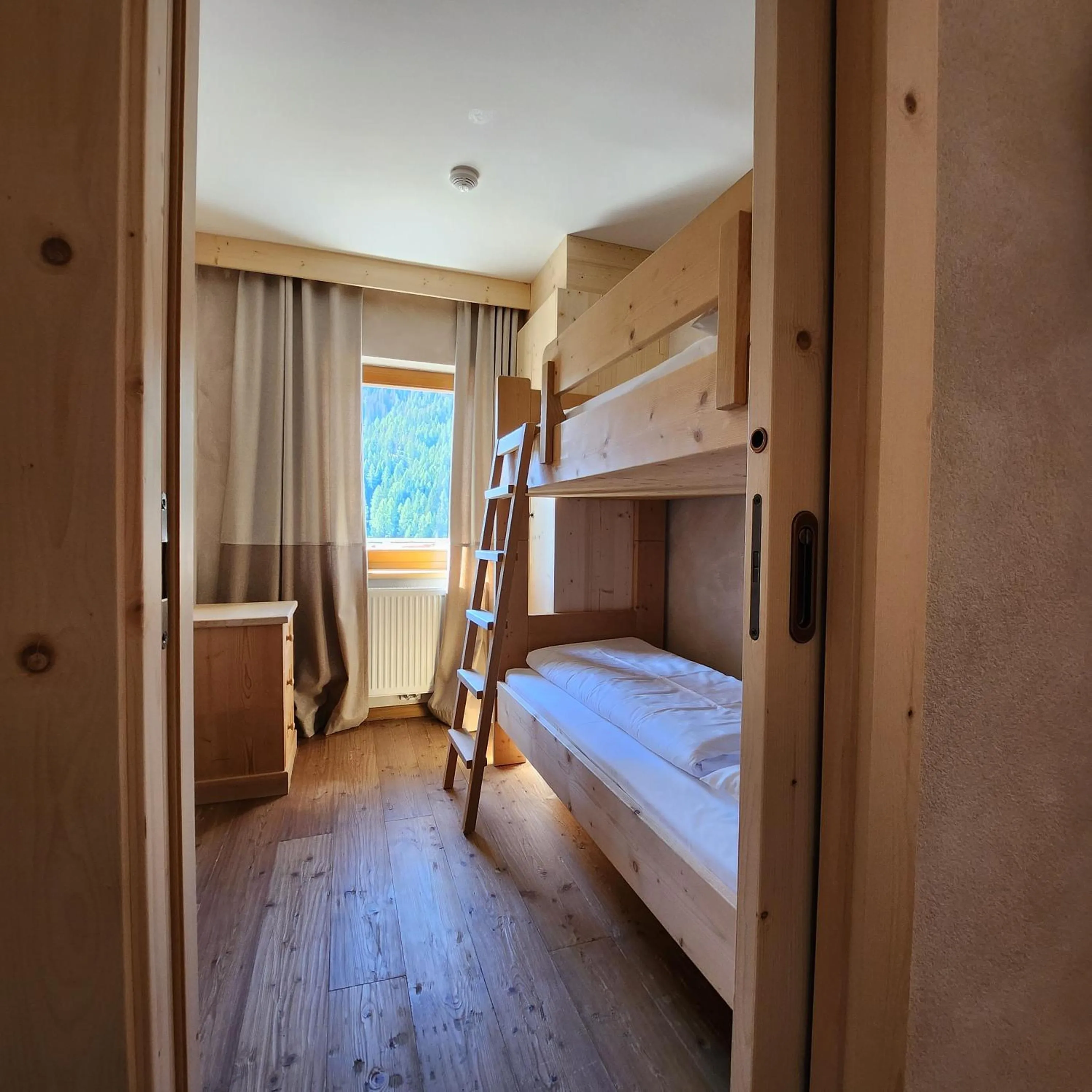 Bed in Family and Wellness Residence Ciasa Antersies