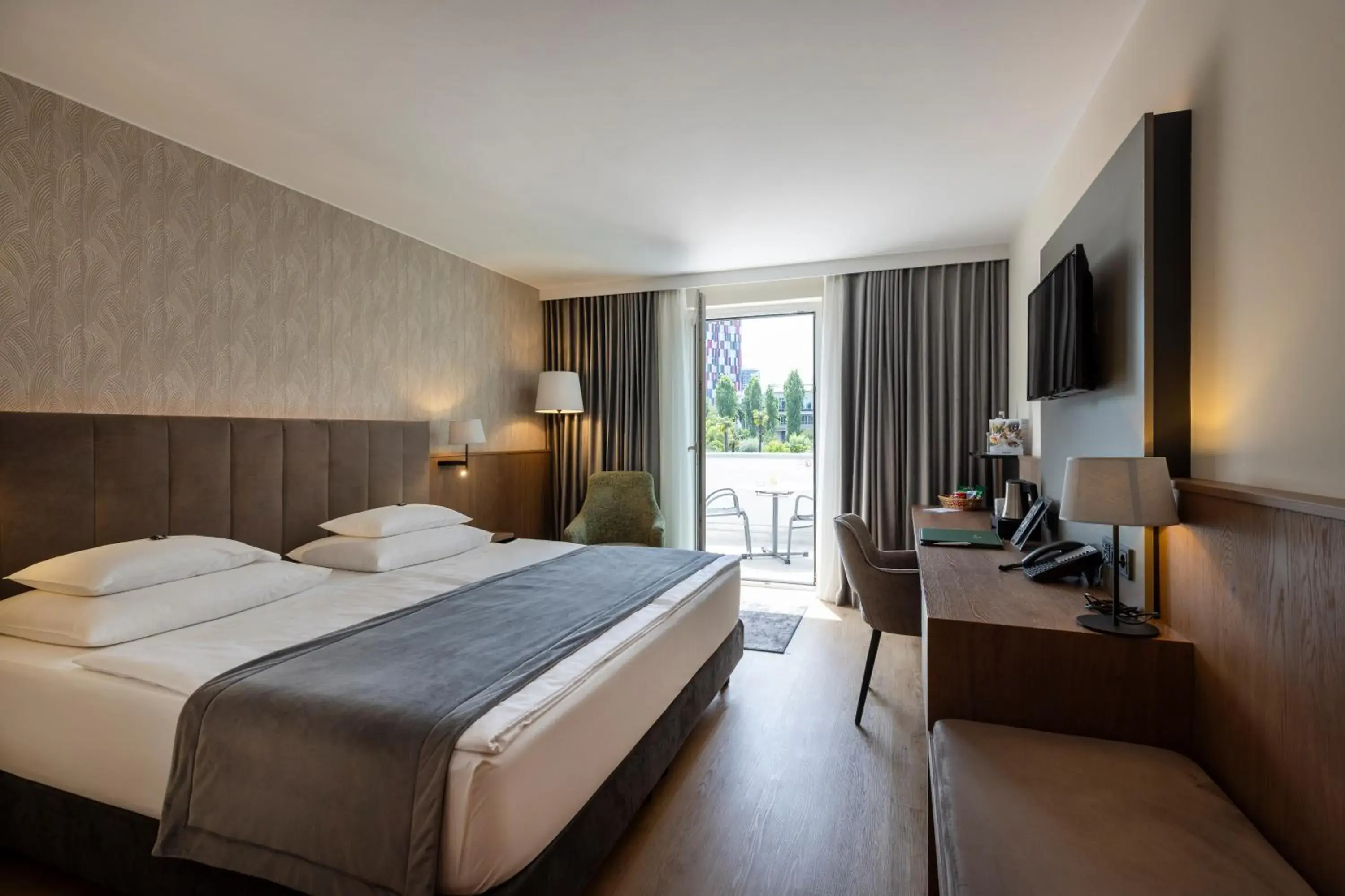 Deluxe Room with Garden View and Balcony - single occupancy in Rogner Hotel Tirana Deluxe Room with Garden View and Balcony - single occupancy in Rogner Hotel Tirana