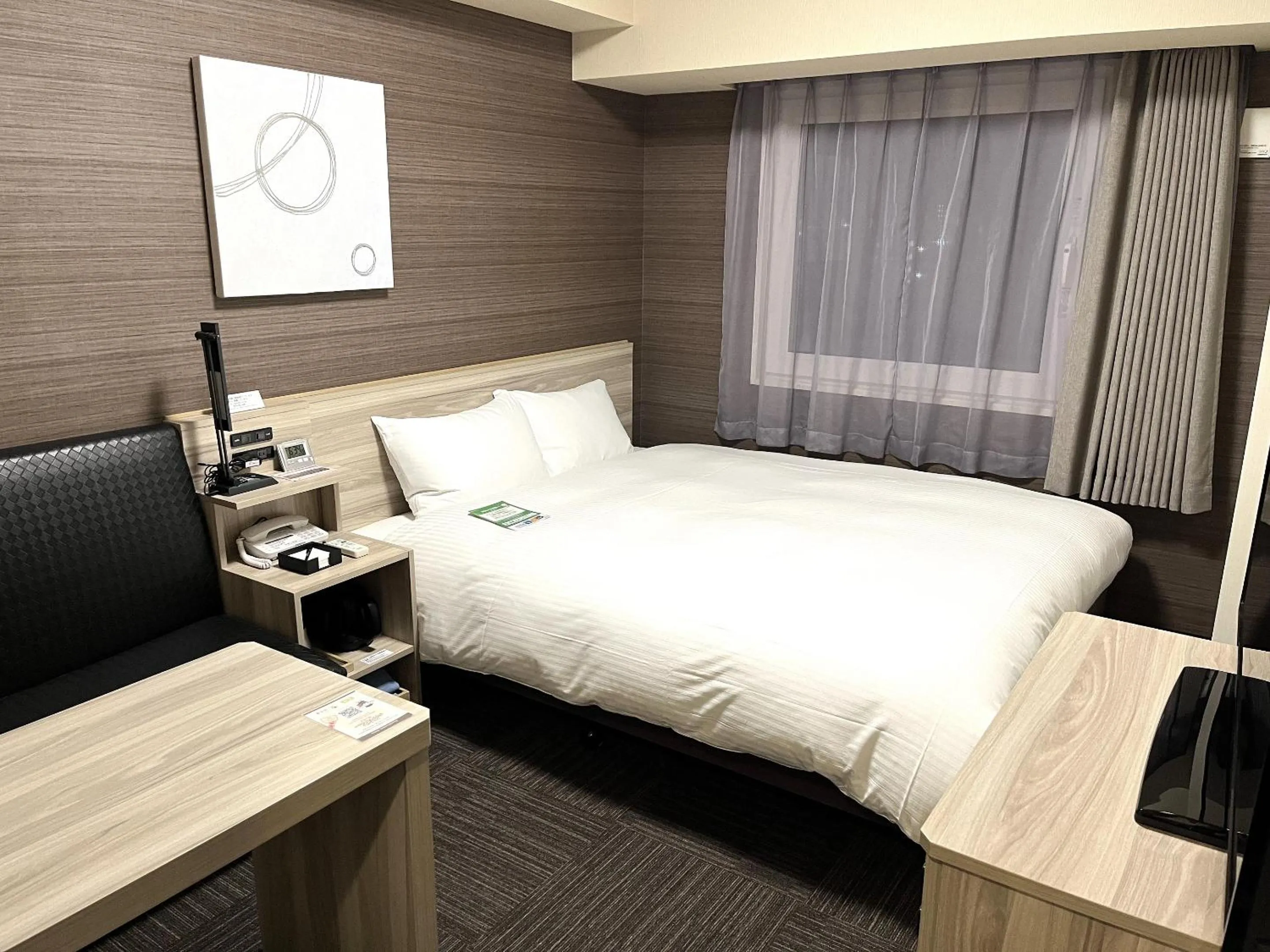 Photo of the whole room, Bed in Hotel Route Inn Takamatsu Yashima