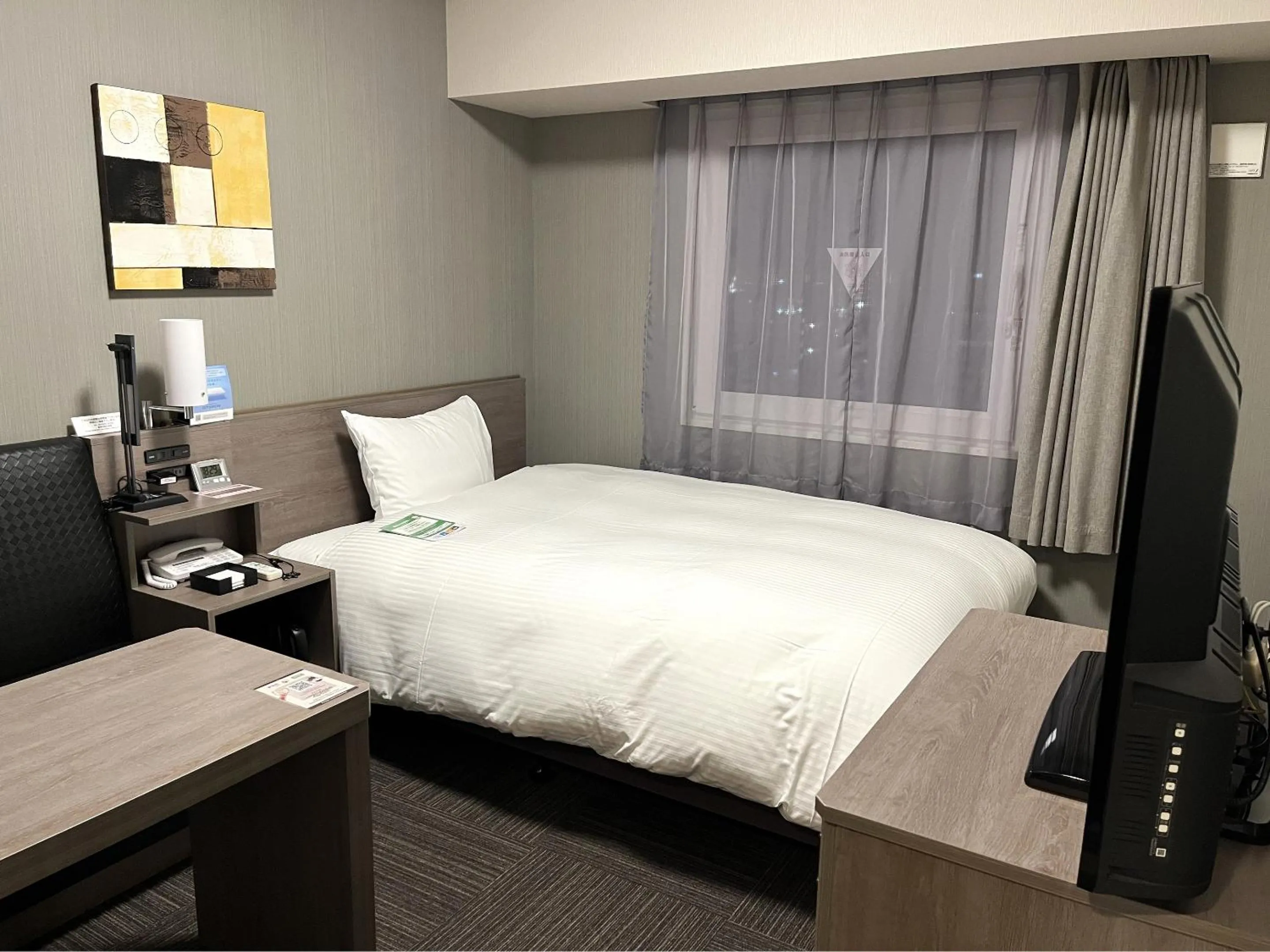 Photo of the whole room, Bed in Hotel Route Inn Takamatsu Yashima