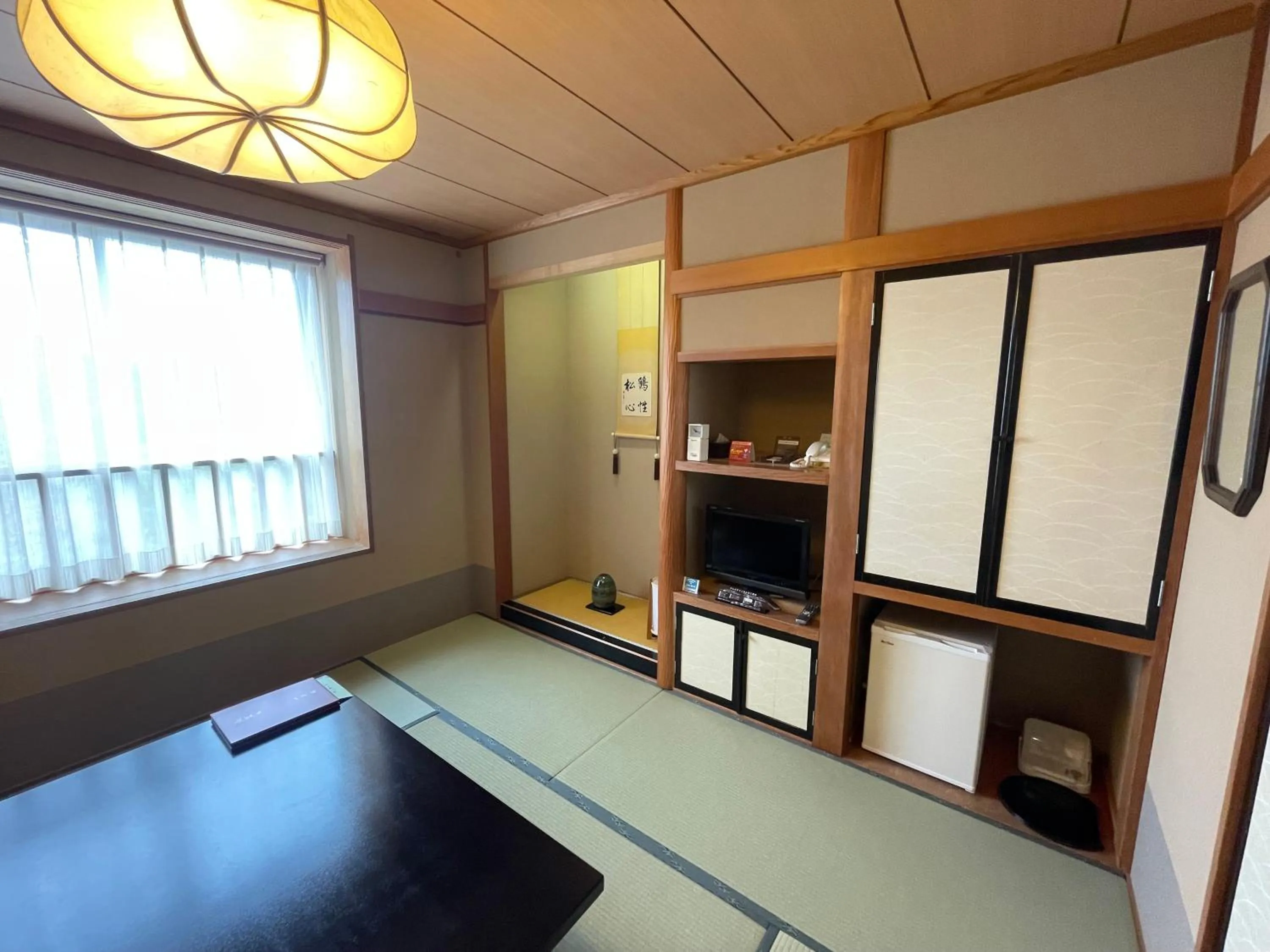 Living room, Bed in Ryokan Ichinomatsu