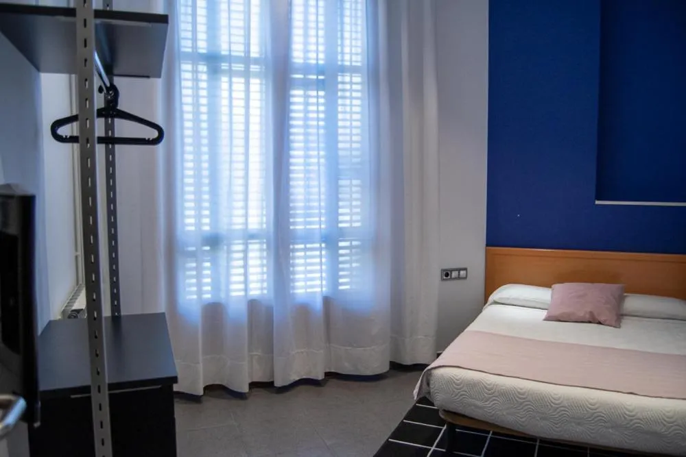 Photo of the whole room, Bed in Hostal Apolo