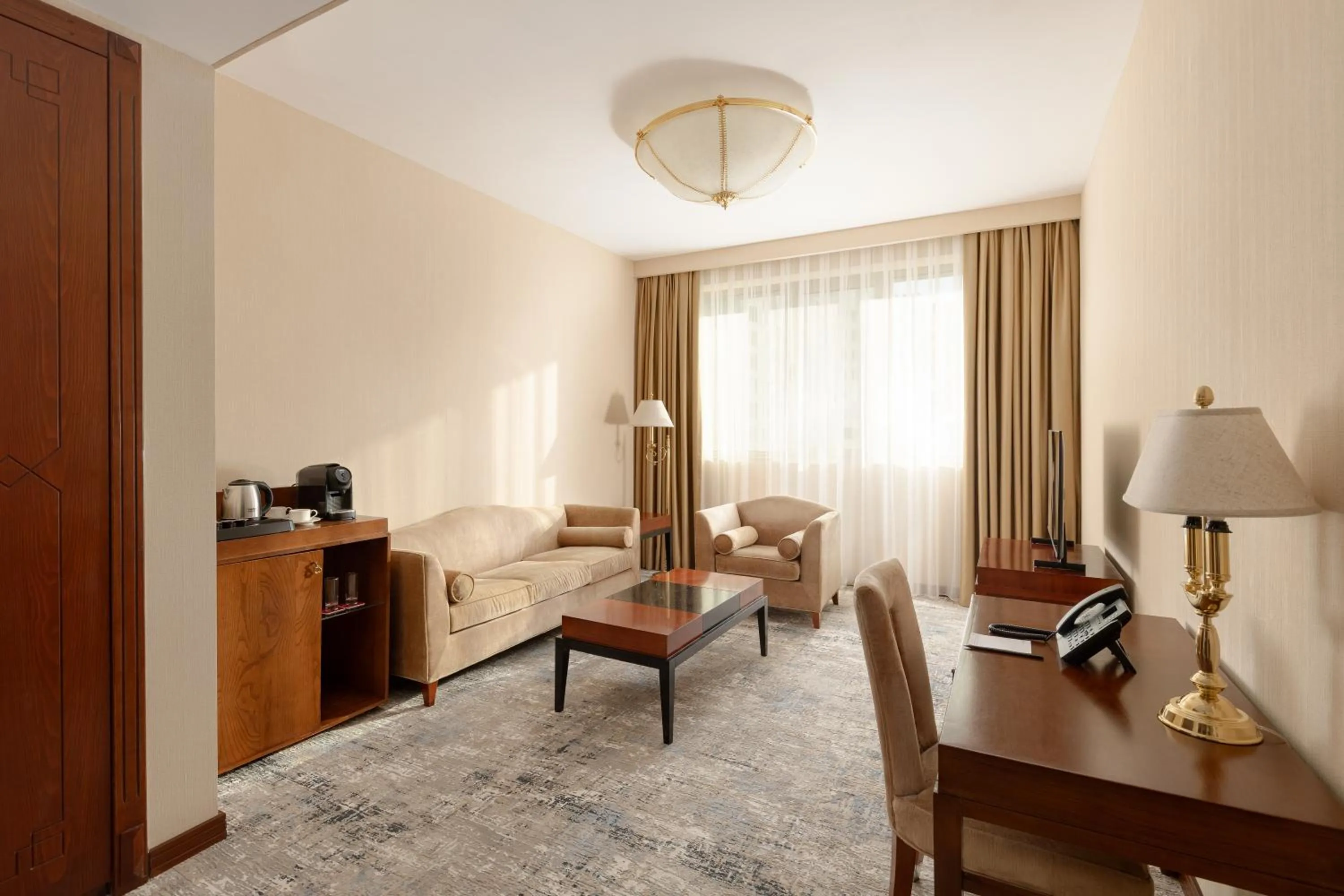 Living room in Ramada Plaza by Wyndham Gence