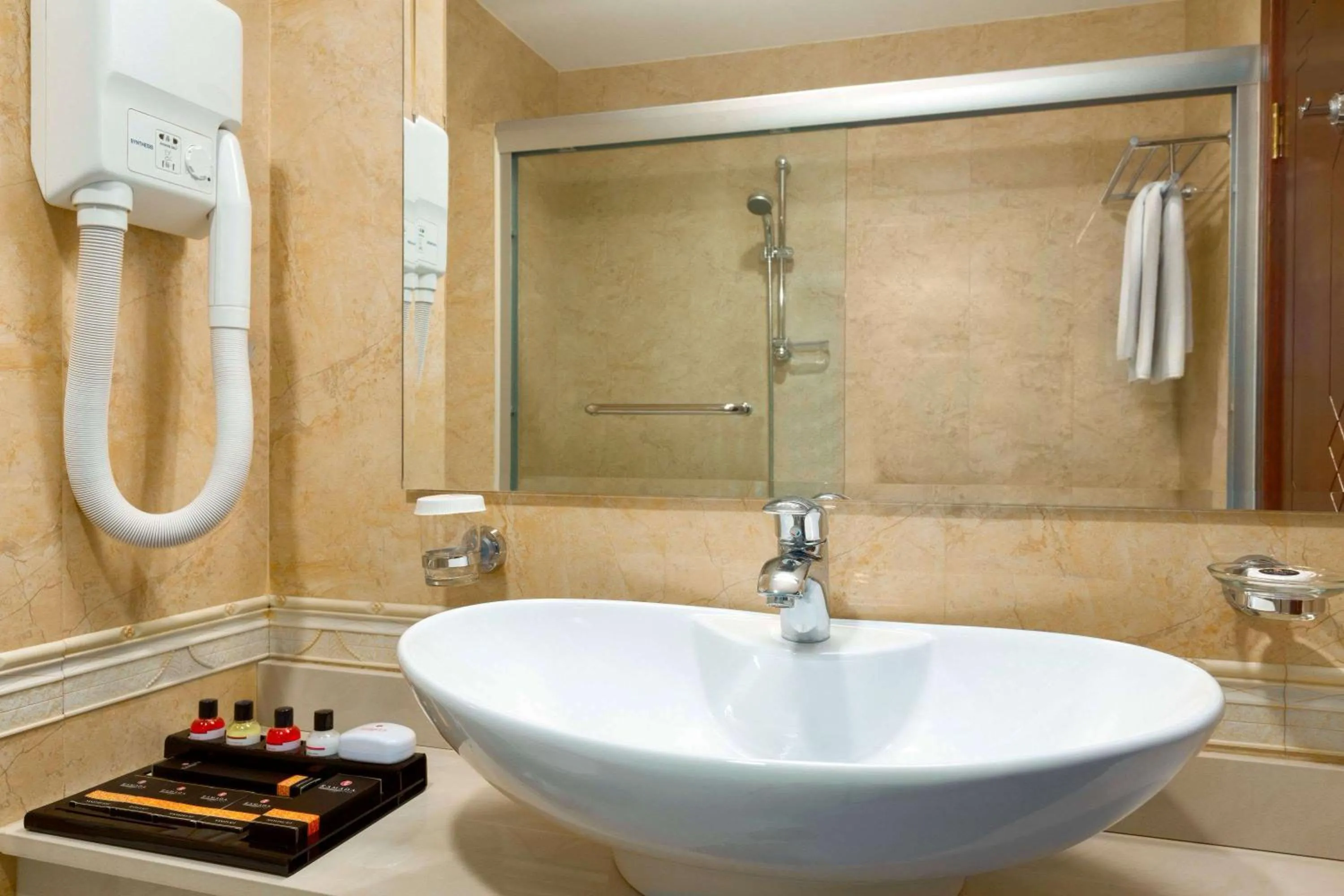 Bathroom in Ramada Plaza by Wyndham Gence