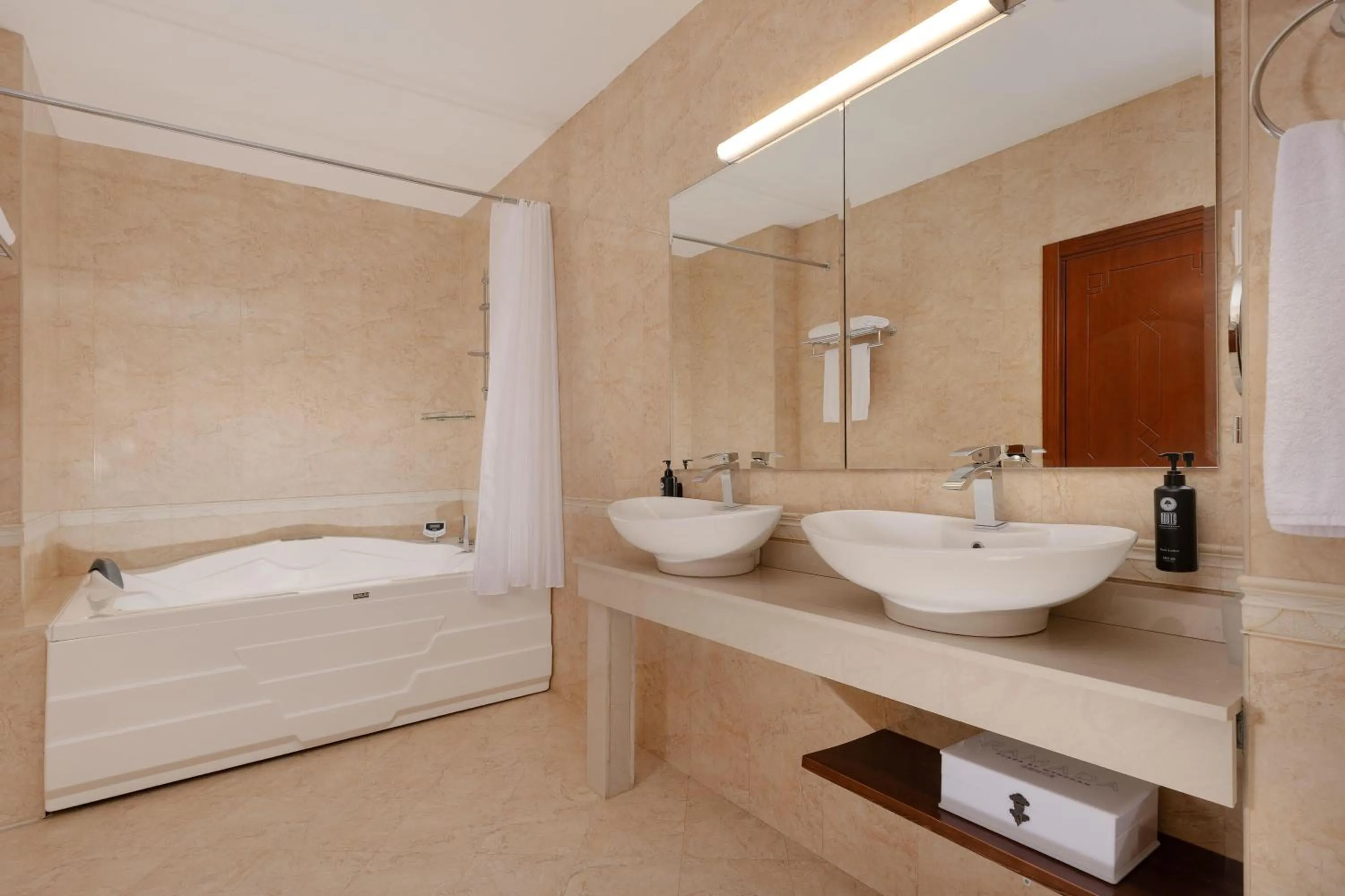 Bathroom in Ramada Plaza by Wyndham Gence