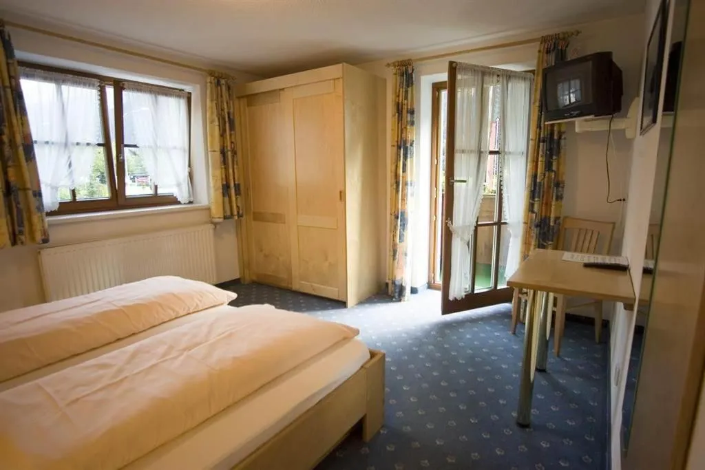 Photo of the whole room, Bed in Gasthaus Muntafuner Stöbli