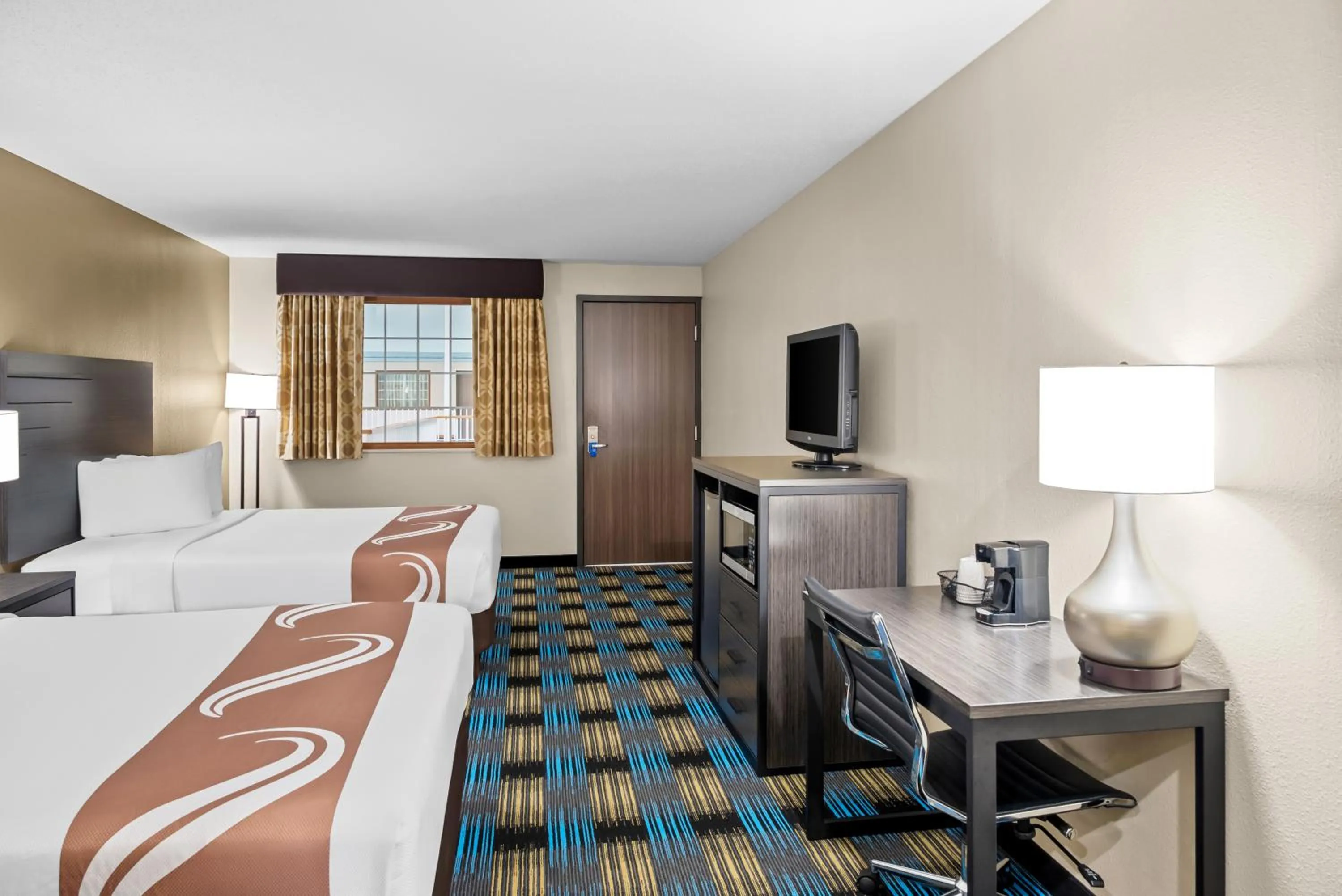 Bed in Rodeway Inn Grandville - Grand Rapids