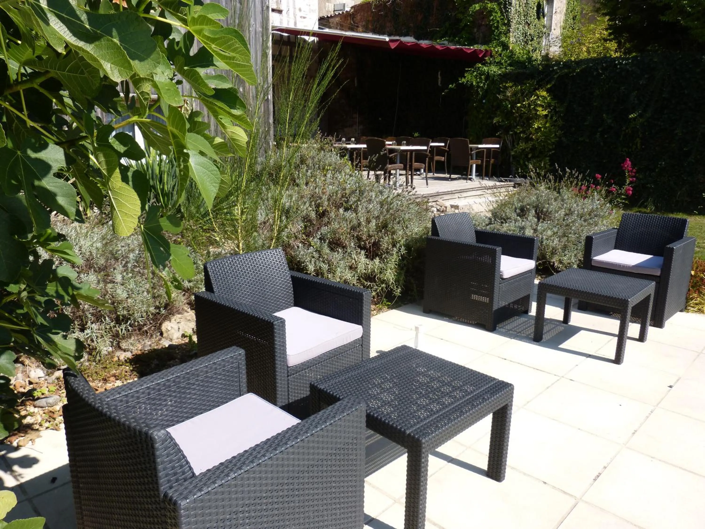 Garden view in Logis Hotel Auberge Dupuytren