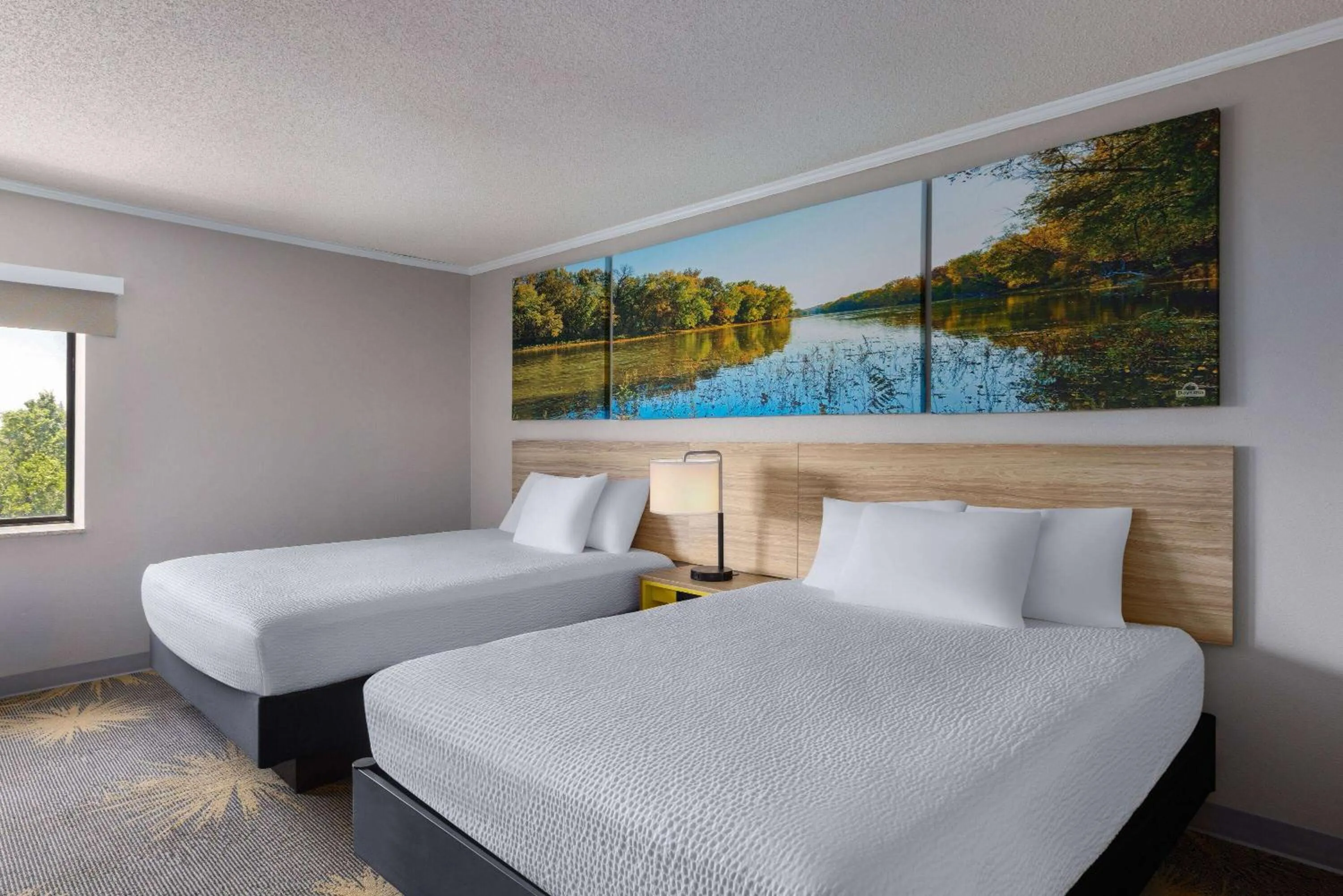 Photo of the whole room, Bed in Days Inn & Suites by Wyndham Kansas City - CHIEFS Stadium