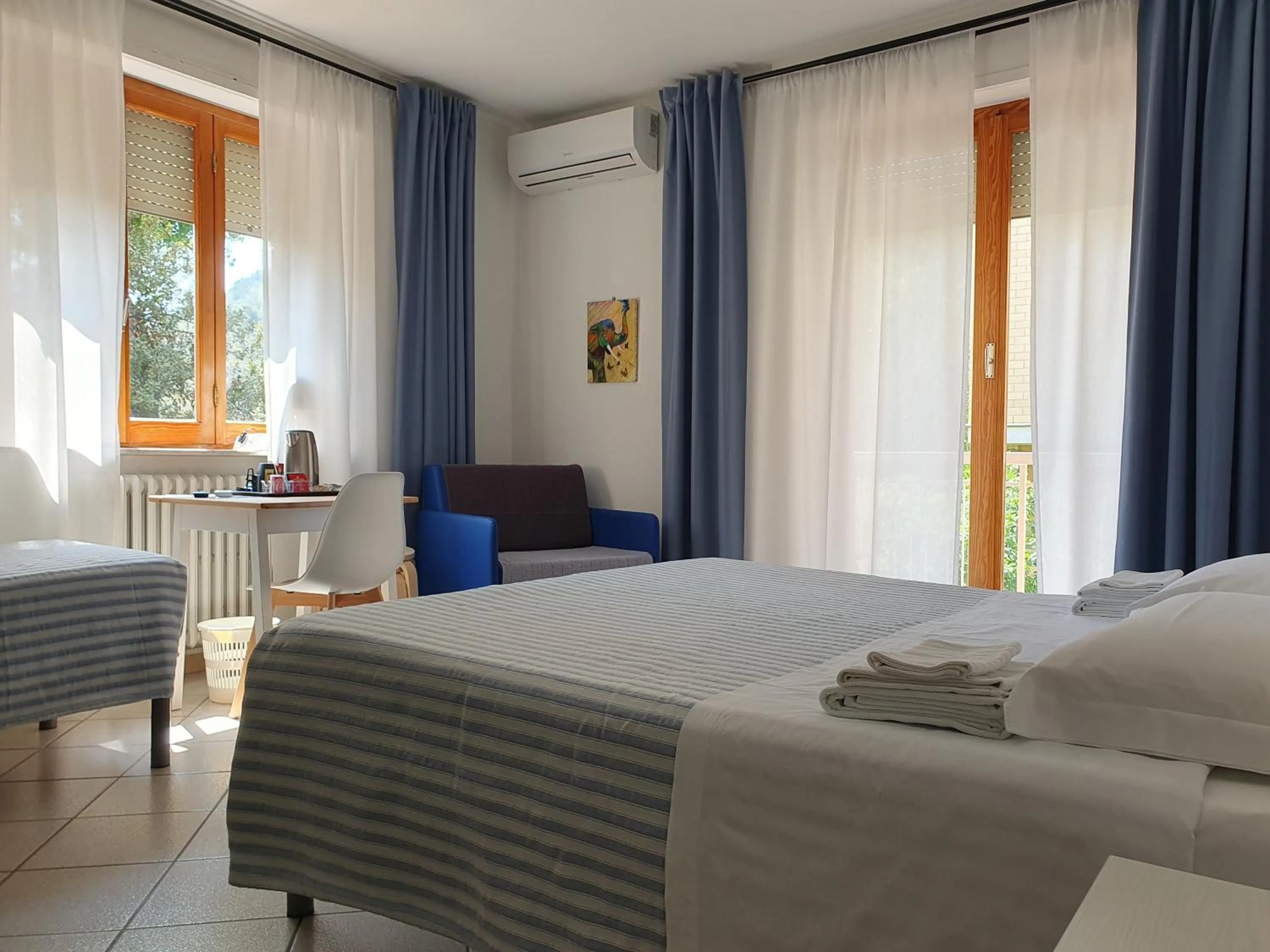 Bed in Hotel Cormorano