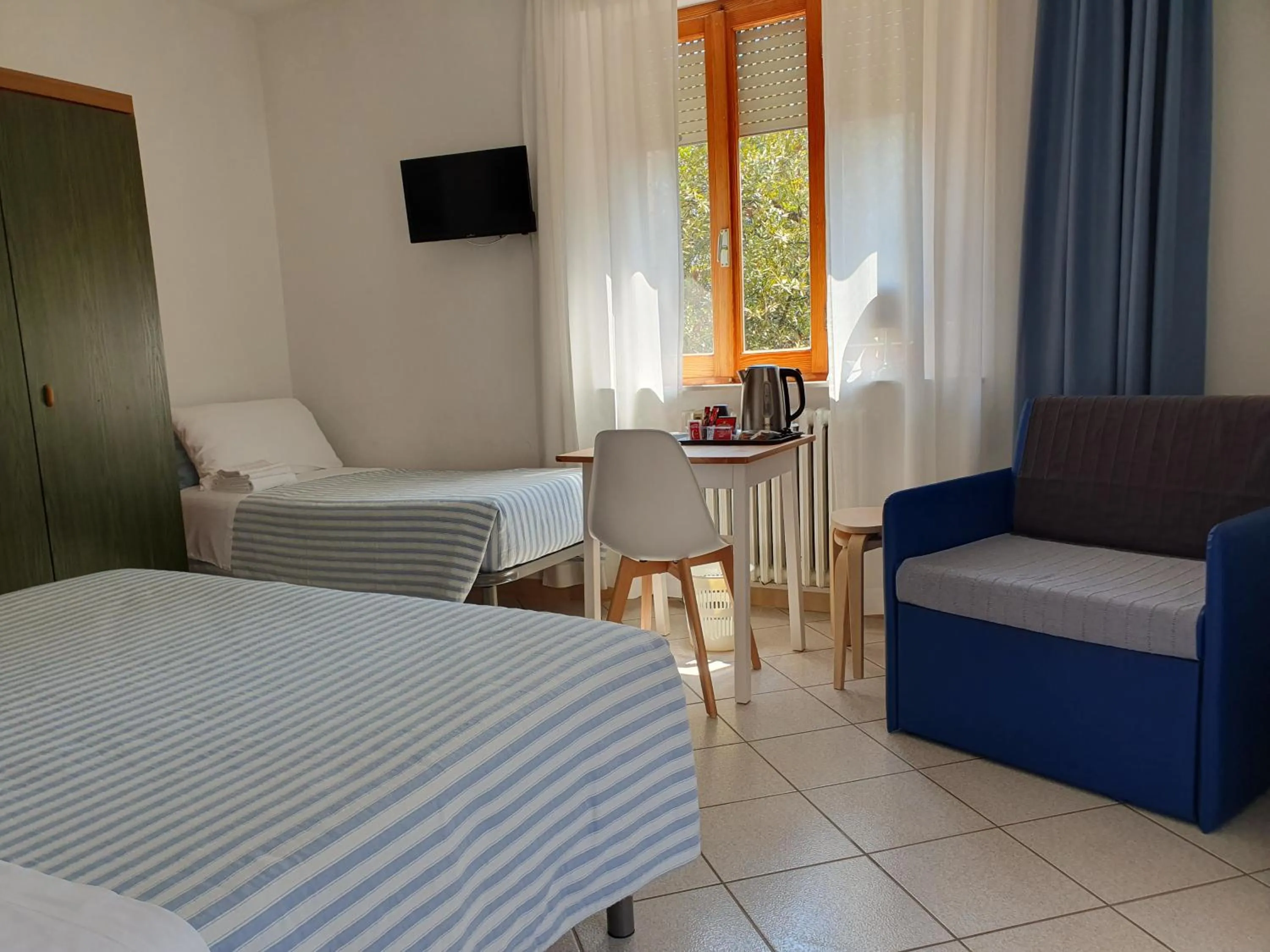 Bed in Hotel Cormorano